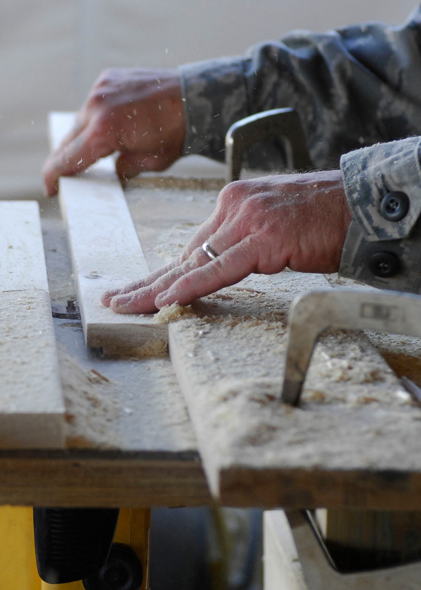 BAGRAM AIRFIELD, Afghanistan -- Staff Sgt. Troy Jorgenson, an engineering assistant from the 455th Expeditionary Civil Engineering Squadron, uses a router to cut away pieces of the plywood Oct. 29, 2009.  The wood will be used as picture frames for the wing headquarters building.  Sergeant Jorgenson is deployed from the Nevada Air National Guard's 152nd CES, and hails from Reno, Nev.  (U.S. Air Force photo/Senior Airman Felicia Juenke)