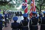 Air Marshal Simon Bryant, (center left) Royal Air Force air member for personnel and deputy commander-in-chief personnel, and General Stephen Lorenz, Air Education and Training Command commander, render salutes at an honors ceremony during the Royal Air Force visit to Headquarters AETC. (U.S. Air Force photo by Rich McFadden)