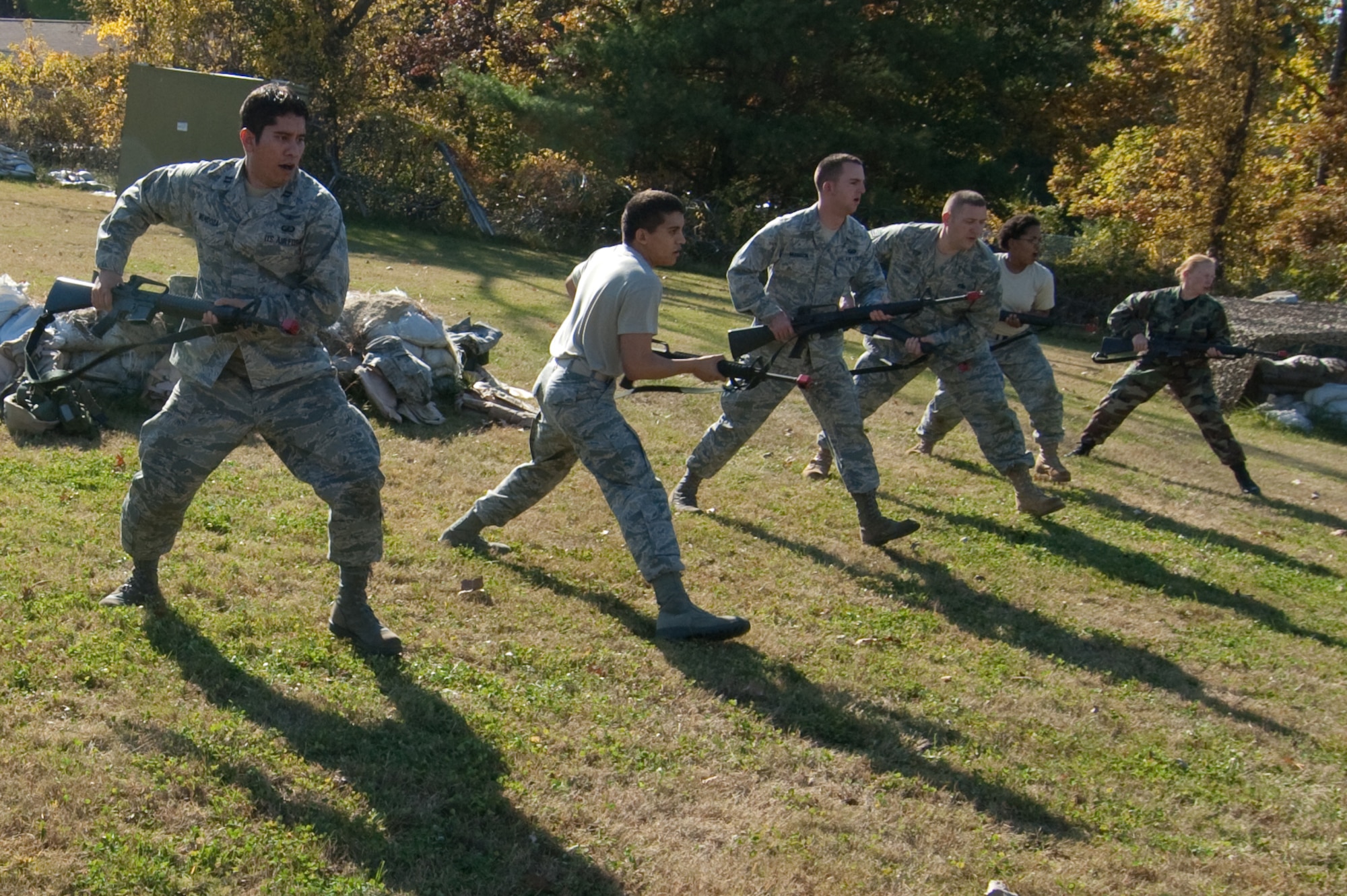 HANSCOM AIR FORCE BASE, Mass. - Hanscom Airmen preparing to deploy practice rifle fighting skills with M-16s during the Expeditionary Airmen Combat Skills Training session on Oct. 22 at Camp Patriot. (U.S. Air Force Photo by Rick Berry)