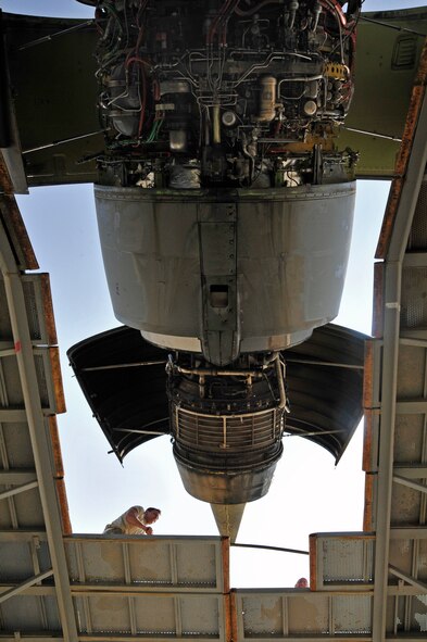 Staff Sgt. Nick Frazier, 380th Expeditionary Aircraft Maintenance Squadron, configures a maintenance stand in preparation to change the No. 2 engine on a KC-10 Extender aircraft at a base in Southwest Asia on Oct. 28, 2009. Sergeant Frazier is a jet propulsion systems mechanic deployed from Air Mobility Command's Travis Air Force Base, Calif., and hails from Buffalo, N.Y. (U.S. Air Force photo/Tech. Sgt. Charles Larkin Sr.) 