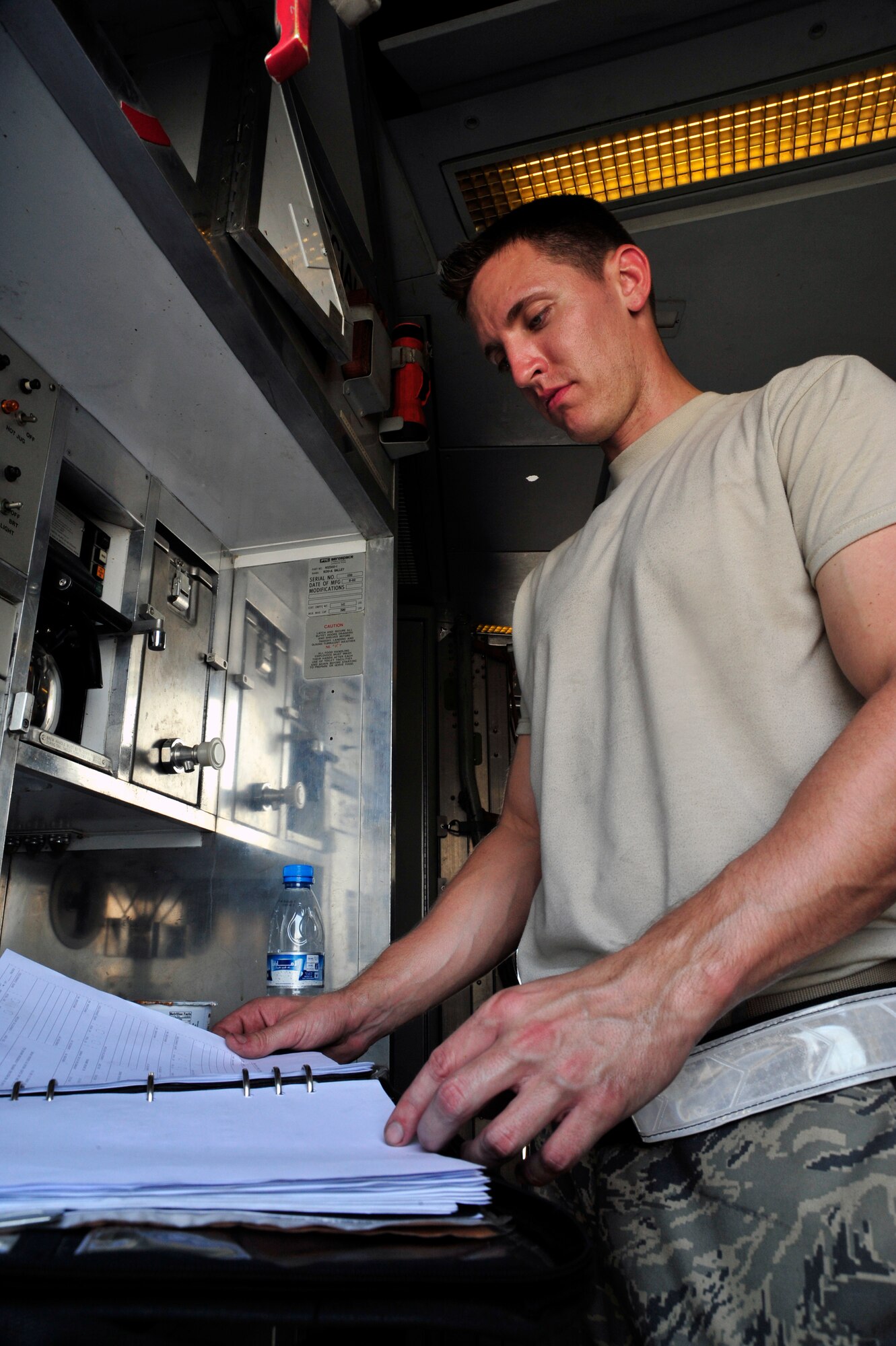 SOUTHWEST ASIA -Staff Sgt. Nick Frazier, 380th Expeditionary Aircraft Maintenance Squadron, reviews the aircraft forms while preparing a KC-10 Extender for an engine change Oct. 28, 2009. Sergeant Frazier is a jet propulsion systems mechanic deployed from Travis Air Force Base, Calif., and hails from Buffalo, N.Y. (U.S. Air Force photo/Tech. Sgt. Charles Larkin Sr)