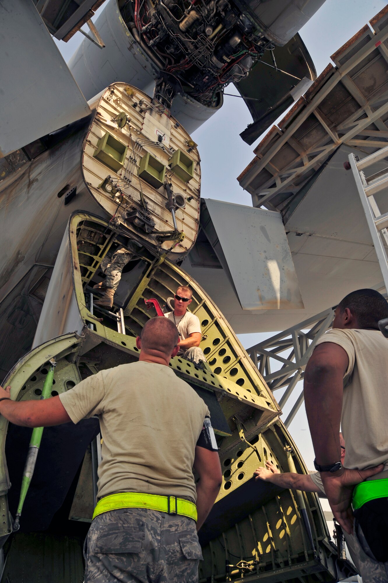 SOUTHWEST ASIA -Airmen from the 380th Expeditionary Aircraft Maintenance Squadron prepare a KC-10 Extender for an engine change Oct. 28, 2009. The Airmen followed technical orders to properly prepare for a No. 2 engine change, located on the upper empennage of the aircraft. (U.S. Air Force photo/Tech. Sgt. Charles Larkin Sr)
