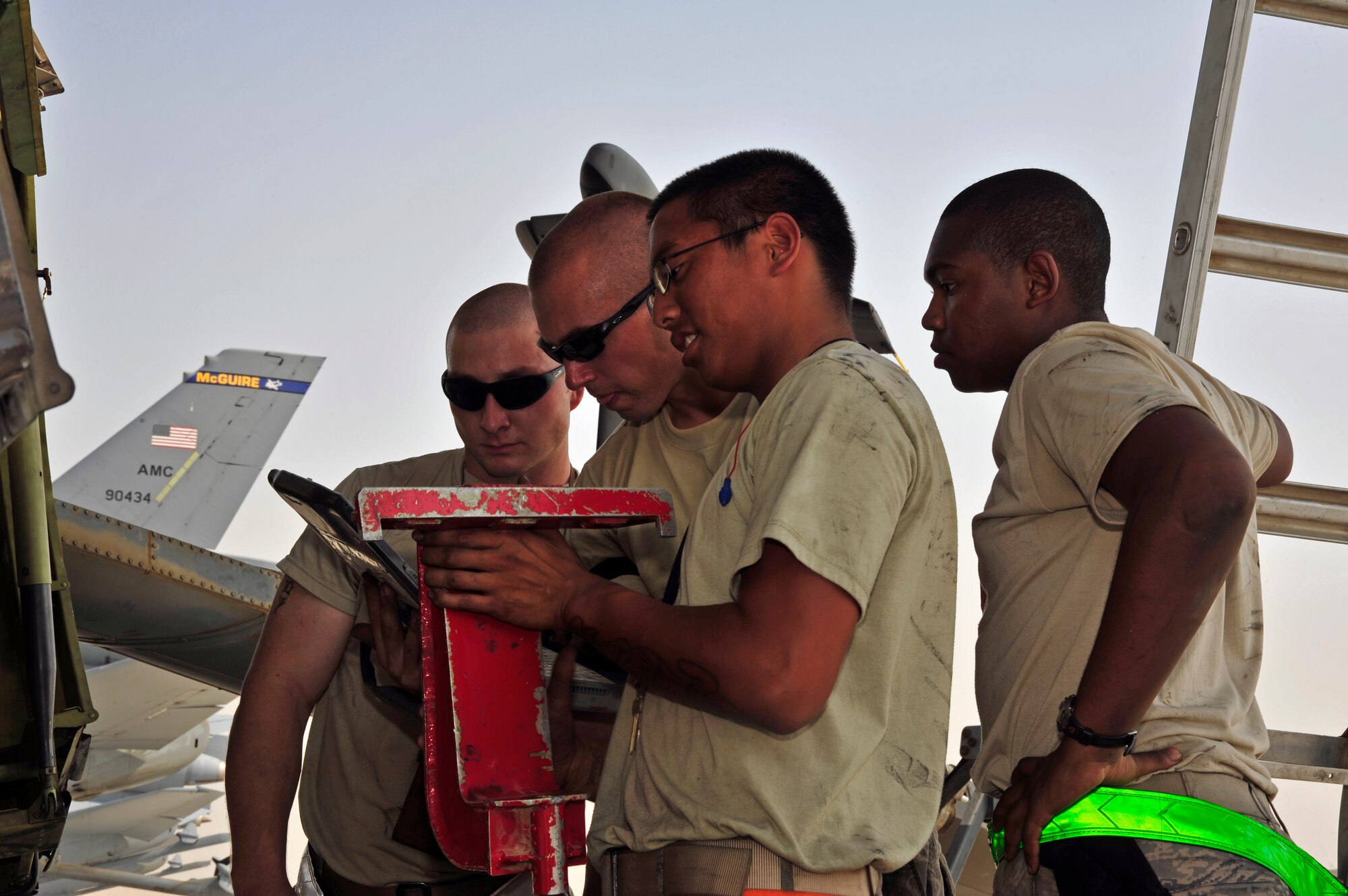SOUTHWEST ASIA -Airmen from the 380th Expeditionary Aircraft Maintenance Squadron prepare a KC-10 Extender for an engine change Oct. 28, 2009. The Airmen followed technical orders to properly prepare for a No. 2 engine change, located on the upper empennage of the aircraft. (U.S. Air Force photo/Tech. Sgt. Charles Larkin Sr)