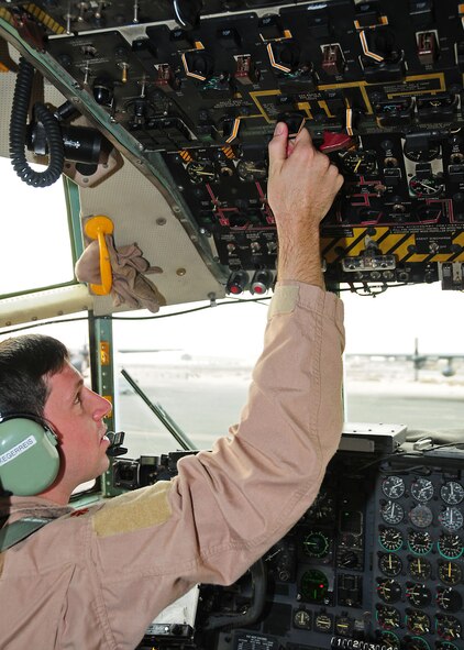 SOUTHWEST ASIA -- Maj. Dave Kegerris, 386th Expeditionary Operations Support Squadron aircraft commander, goes through pre flight checks onboard a C-130 Hercules at an undisclosed location in Southwest Asia Oct. 28, 2009.  Maj. Kegerris is deployed from the 36th Airlift Squadron, Yokota Air Base, Japan, and hails from Crestview, Fla.  (U.S. Air Force photo/Tech. Sgt. Tony Tolley)