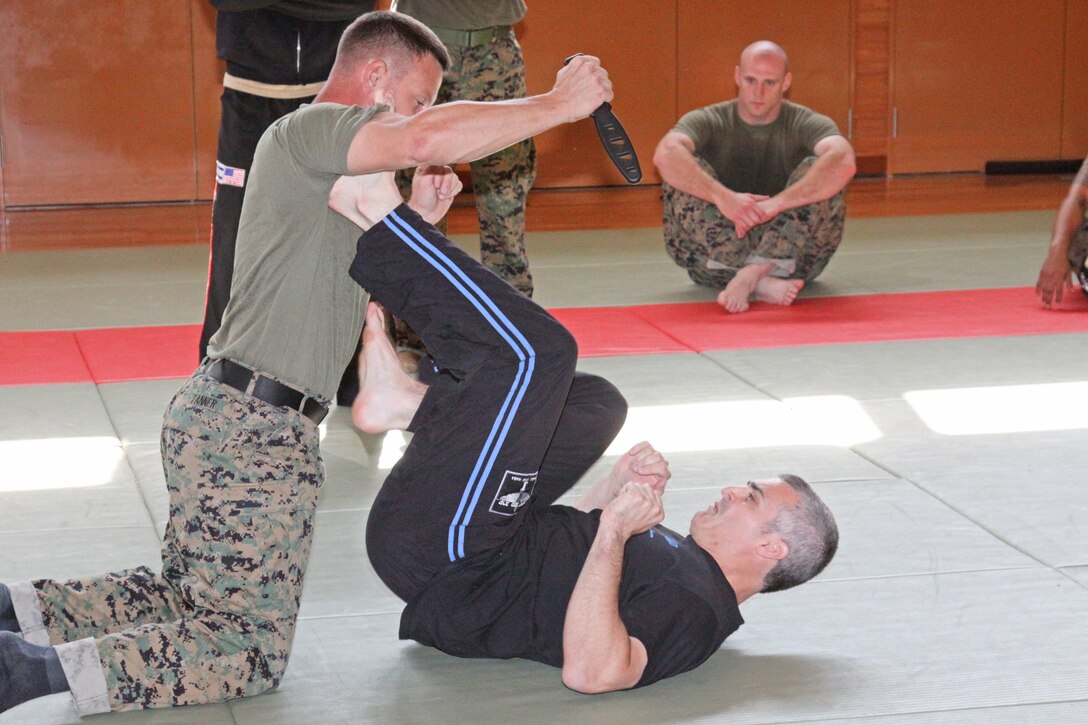 David Kahn, Israeli Krav Maga Association U.S. Chief Instructor and IKMA board member, demonstrates how to defend against a knife attack while on the ground during a weeklong Israeli Krav Maga course held here Oct. 27-30. Krav Maga translated means “contact combat” or “close combat” and is an eclectic hand-to-hand combat system developed in Israel in the late 1940s.