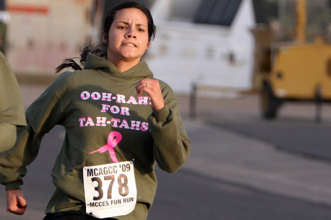 Myriam Chaidez sprints toward the finish line during the Marine Corps Communications-Electronics School Fun Run Oct. 30.  The event is held twice a year to raise money for MCCES functions.