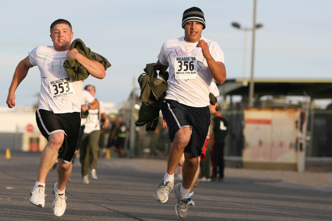 Participants in the Marine Corps Communications-Electronics School Fun Run stride for the finish line during the biannual event Oct. 30. Nearly 600 installation personnel braved the morning cold to take part in the run.