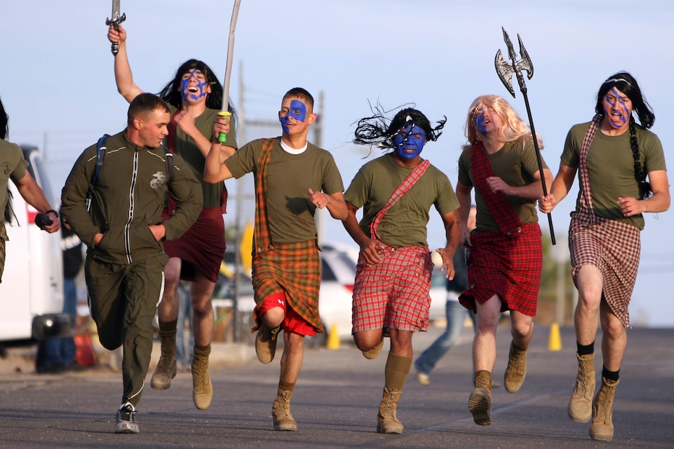 Marines dressed as Scottish commoners from the 1995 Mel Gibson flick, “Braveheart,” charge the finish line during the biannual Marine Corps Communications-Electronics School Fun Run Oct. 30. Runners are always encouraged to wear costumes during the run, which is held around St. Patrick’s Day and Halloween each year.