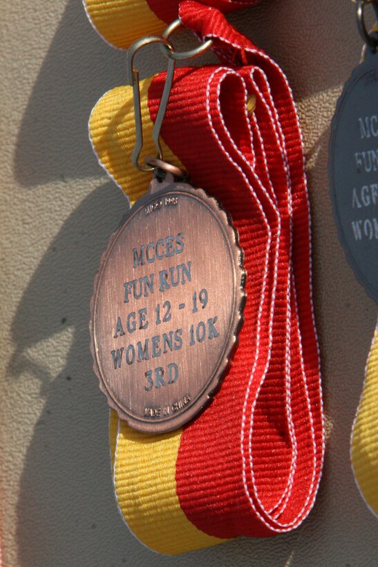 Nearly 600 Combat Center personnel gathered at the Marine Corps Communications-Electronics School biannual Fun Run Oct. 30. Runners who finished in the top spots in each field classification received medals for their performance.