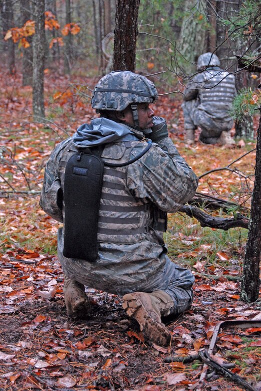 Air Force Master Sgt. Charles Battle, 113th Security Forces Squadron Squad Leader, calls out orders under simulated fire during unmounted patrol training on October 27, 2009. The 113SFS is engaged in pre-deployment training exercises conducted by the U.S. Air Force Expeditionary Center's 421st Combat Training Squadron at Joint Base McGuire-Dix-Lakehurst, N.J. (U.S. Air Force photo/Tech. Sgt. Adrianne L. Wilson)