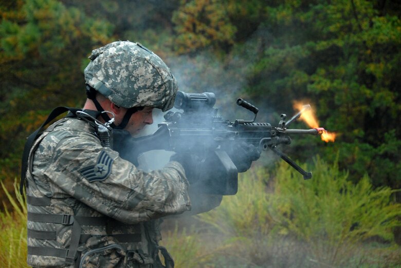 Air Force Staff Sgt. Mark Mondy, 113th Security Forces Squadron Fire Team member, fires his M249 light machine gun during unmounted patrol training on October 27, 2009. The 113SFS is engaged in pre-deployment training exercises conducted by the U.S. Air Force Expeditionary Center's 421st Combat Training Squadron at Joint Base McGuire-Dix-Lakehurst, N.J. (U.S. Air Force photo/Tech. Sgt. Adrianne L. Wilson)