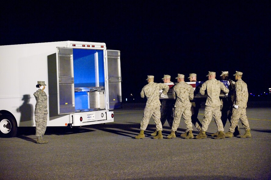 30 October 2009  USAF Photo by Jason Minto.  A U.S. Marine Corps carry team transfer the remains of Marine Lance Cpl Cody R. Stanley., of Rosanky, TX, at Dover Air Force Base, Del., Oct. 30, 2009.  