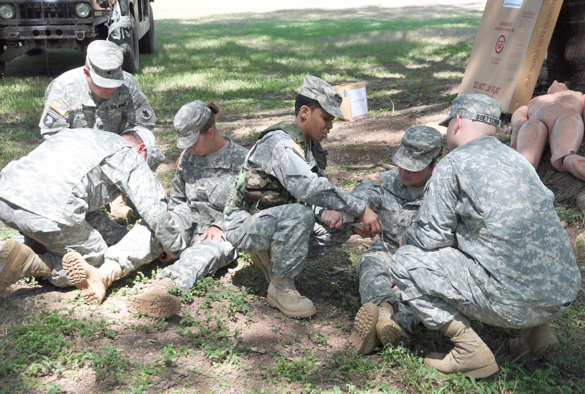 SOTO CANO AIR BASE, Honduras — Soldiers from the 1st Battalion, 228th Aviation Regiment practice some combat lifesaving techniques Oct. 28 at the base firing range during a three-day field training exercise. Soldiers from the 1st Battalion, 228th Aviation Regiment recently turned their focus from helicopter operations to some basic Soldier field training from Oct. 25 to 29. Some of the things taught during the training were: practicing recall procedures, setting up tents, radio communications, convoy operations, combat medicine, vehicle staging, wrecker operations, M-249 light machine gun familiarization and firing the M-249 at the range (U.S. Air Force photo/Staff Sgt. Chad Thompson).