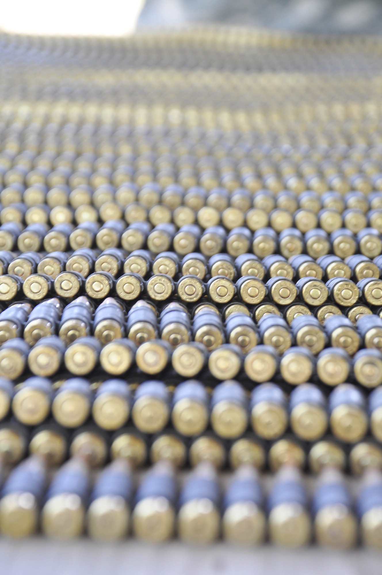 SOTO CANO AIR BASE, Honduras — Thousands of 5.56mm rounds lay on a table Oct. 28 at the base firing range during the M-249 light machine gun familiarization portion of a three-day exercise. Soldiers from the 1st Battalion, 228th  Aviation Regiment recently turned their focus from helicopter operations to some basic Soldier field training from Oct. 25 to 29. Some of the things taught during the training were: practicing recall procedures, setting up tents, radio communications, convoy operations, combat medicine, vehicle staging, wrecker operations, M-249 light machine gun familiarization and firing the M-249 at the range (U.S. Air Force photo/Staff Sgt. Chad Thompson).