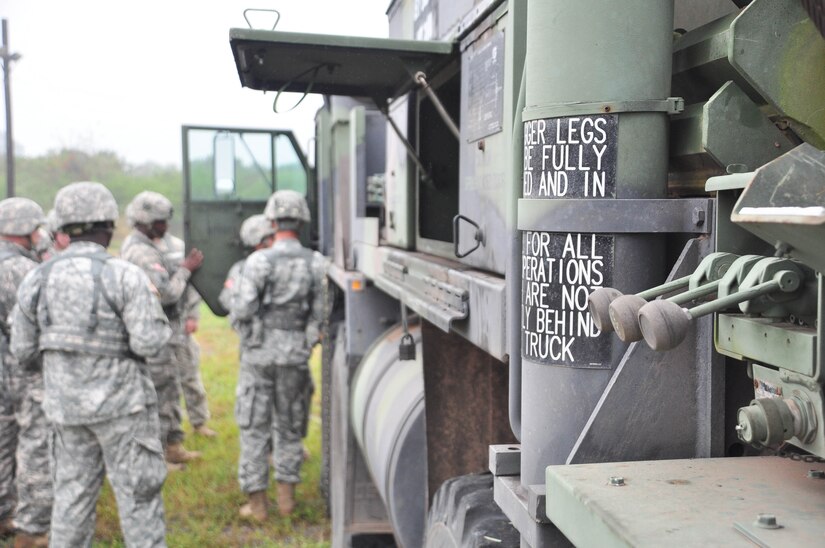 SOTO CANO AIR BASE, Honduras — Soldiers from 1st Battalion, 228th Aviation Regiment get basic familiarization of the Heavy Expanded Mobility Tactical Truck, or HEMTT, Oct. 28 behind the base rappelling station during the wrecker operations portion of a three-day exercise. Soldiers from the 1-228th Aviation Regiment recently turned their focus from helicopter operations to some basic Soldier field training from Oct. 25 to 29. Some of the things taught during the training were: practicing recall procedures, setting up tents, radio communications, convoy operations, combat medicine, vehicle staging, wrecker operations, M-249 light machine gun familiarization and firing the M-249 at the range (U.S. Air Force photo/Staff Sgt. Chad Thompson).