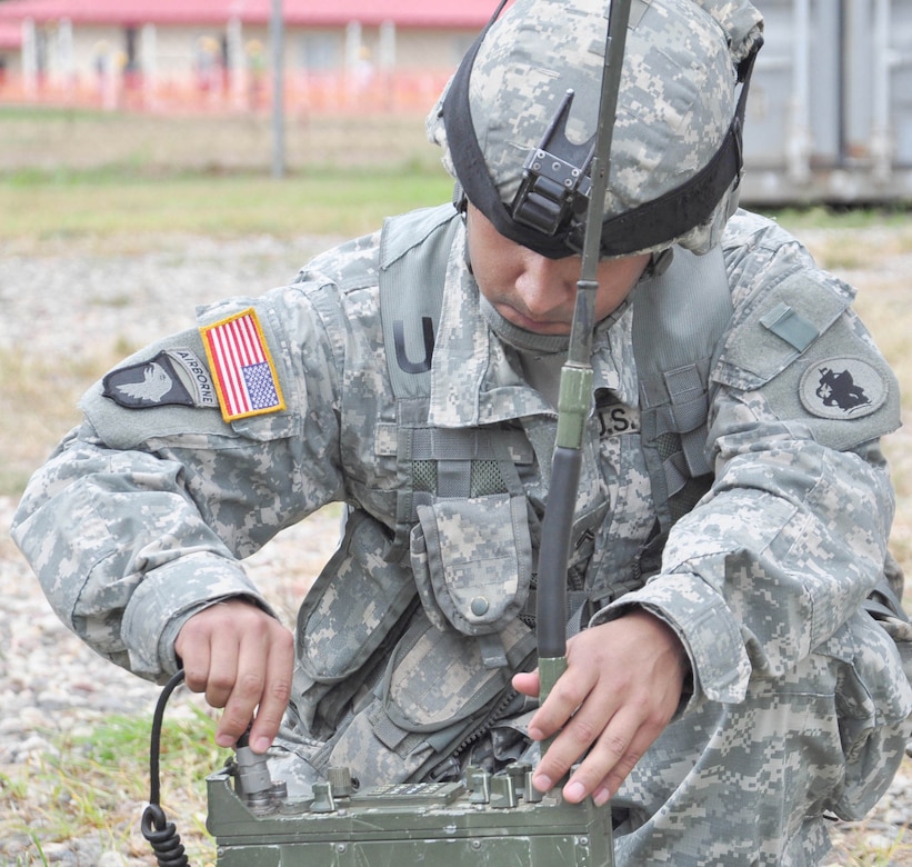 SOTO CANO AIR BASE, Honduras — Cpl. Javier Lopez, 1st Battalion, 228th Aviation Regiment, assembles a radio Oct. 27 behind the base rappelling station during the communication portion of a three-day exercise. Soldiers from the 1-228th Aviation Regiment recently turned their focus from helicopter operations to some basic Soldier field training from Oct. 25 to 29. Some of the things taught during the training were: practicing recall procedures, setting up tents, radio communications, convoy operations, combat medicine, vehicle staging, wrecker operations, M-249 light machine gun familiarization and firing the M-249 at the range (U.S. Air Force photo/Staff Sgt. Chad Thompson).