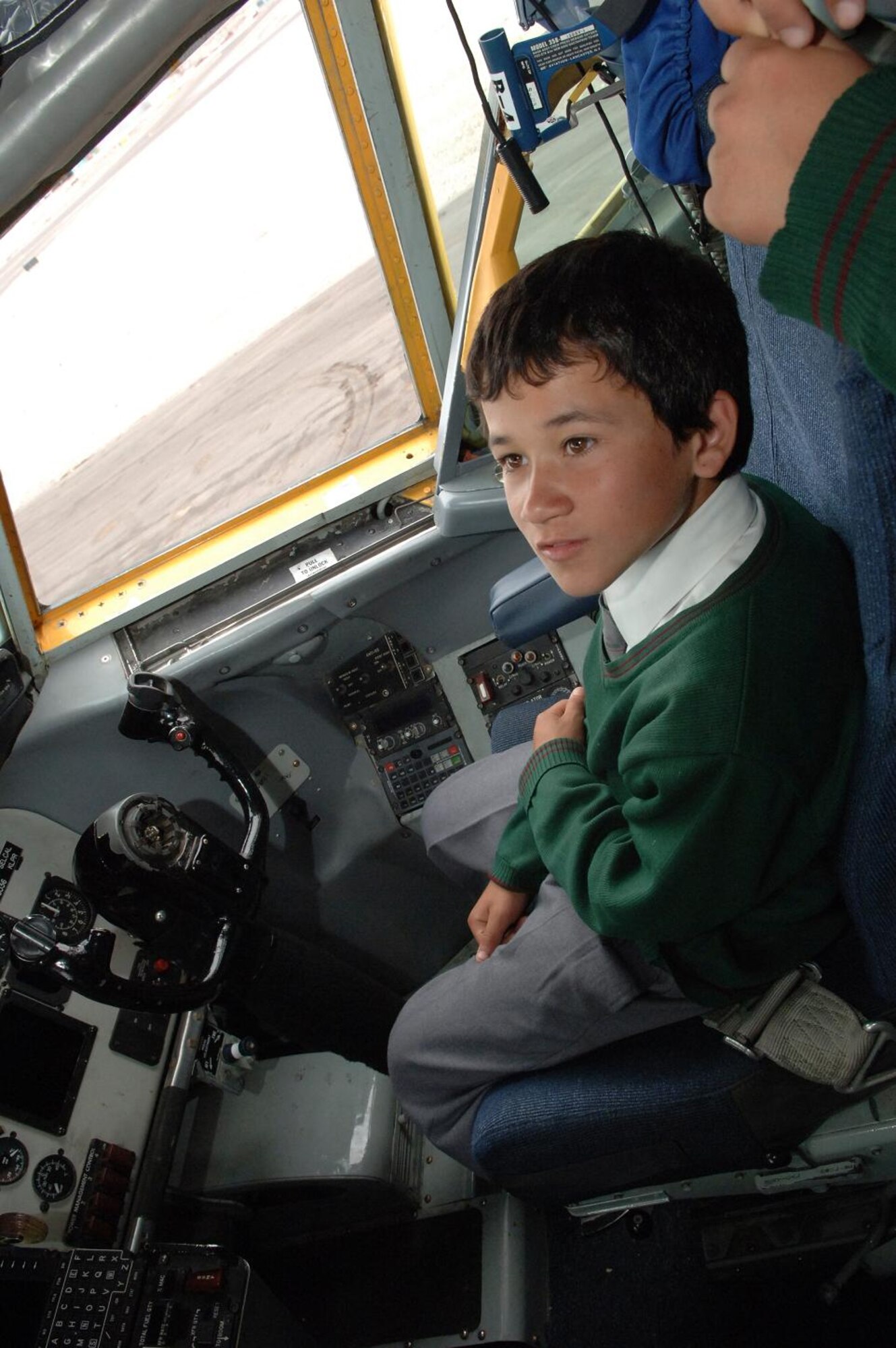 IQUIQUE, Chile -- A young boy from Colegio Macaya school in Alto Hospicia sits in the cockpit of a KC-135 during a base tour here Oct. 30. Students were invited to the base to see U.S. and Chilean Air Force aircraft, and meet Airmen. (U.S. Air Force photo by Tech. Sgt. Eric Petosky)