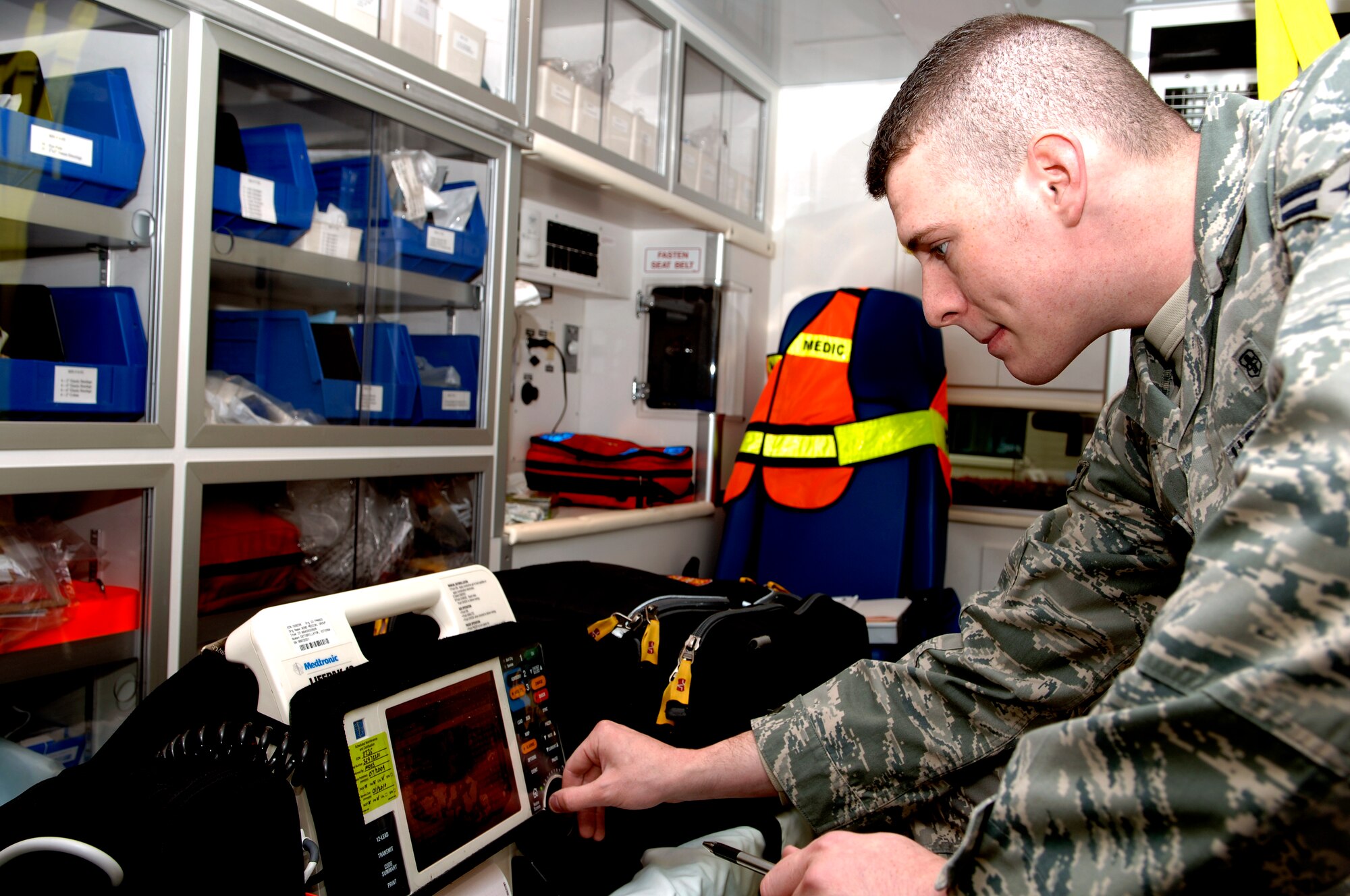 FAIRCHILD AIR FORCE BASE, Wash. – Airman 1st Class Michael Stevens, 92nd Medical Dental Squadron medical technician, operates a defibrillator Oct. 22. The defibrillator is used in conjunction with electrocardiogram readers, which the healthcare provider uses to diagnose a cardiac condition. Depending on the condition the technician will use the defibrillator to send a certain charge to the heart. (US Air Force photo/Airman 1st Class Natasha E. Stannard)