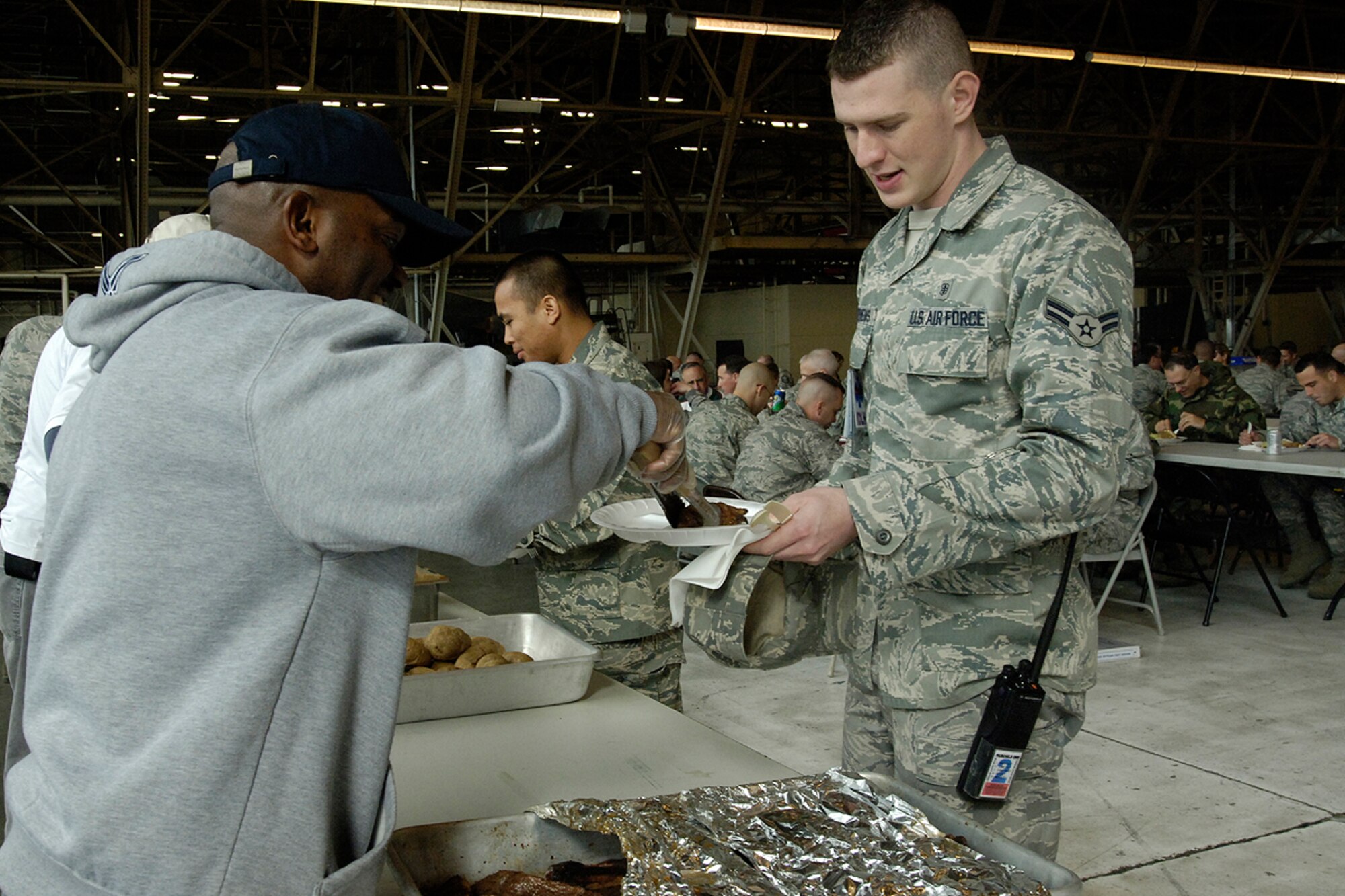 FAIRCHILD AIR FORCE BASE, Wash. – Airman 1st Class Michael Stevens, 92nd Medical Operations Squadron medical technician, proceeds through the serving line at the Chief’s Steak Out here Oct. 21. (U.S. Air Force photo / Staff Sgt. Eunique Stevens) 
