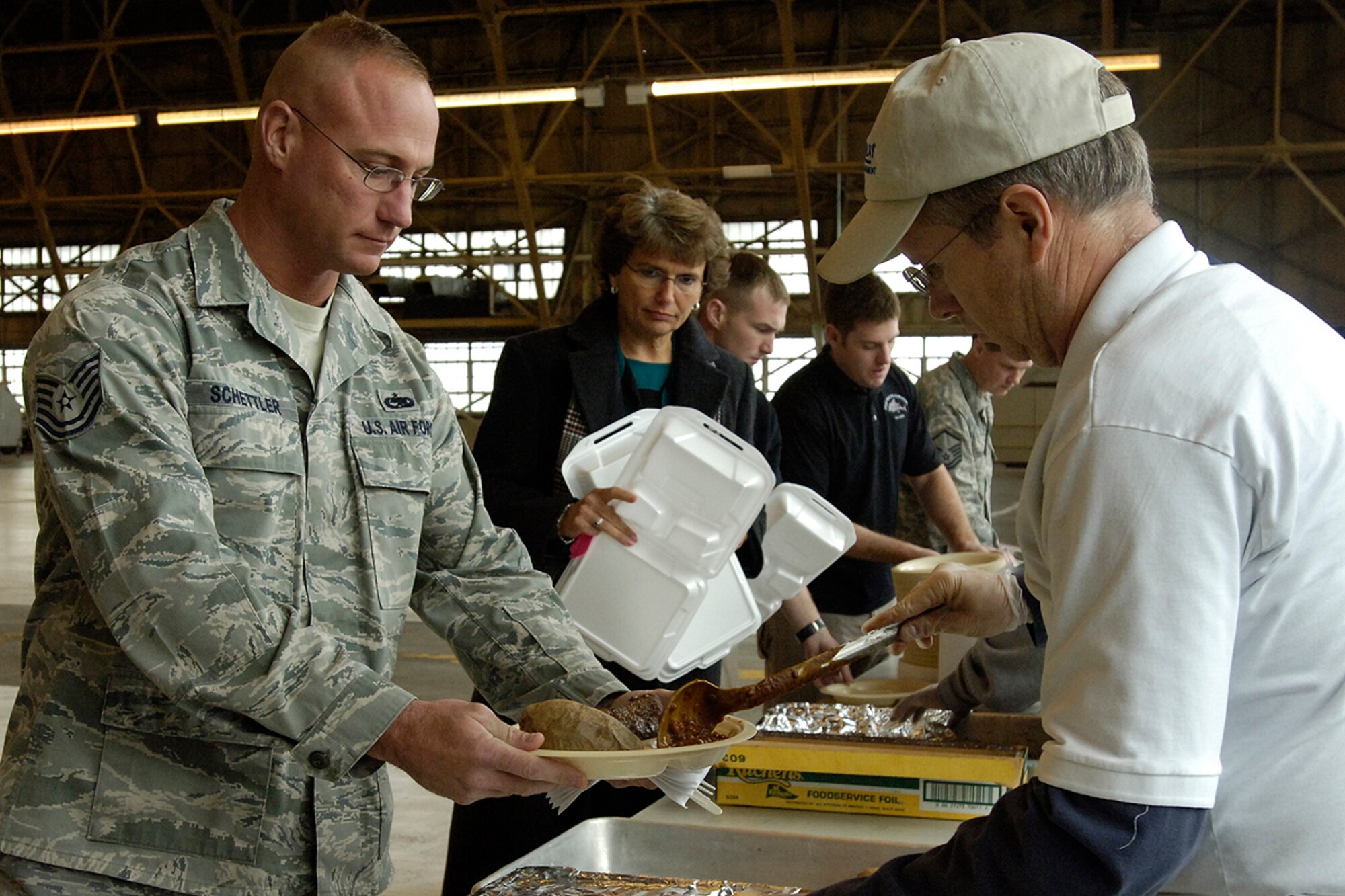 FAIRCHILD AIR FORCE BASE, Wash. – Tech. Sgt. Kevin Schettler, 22nd Maintenance Squadron, McConnell Air Force Base, Kansas, proceeds through the serving line at the Chief’s Steak Out here Oct. 21. (U.S. Air Force photo / Staff Sgt. Eunique Stevens) 



