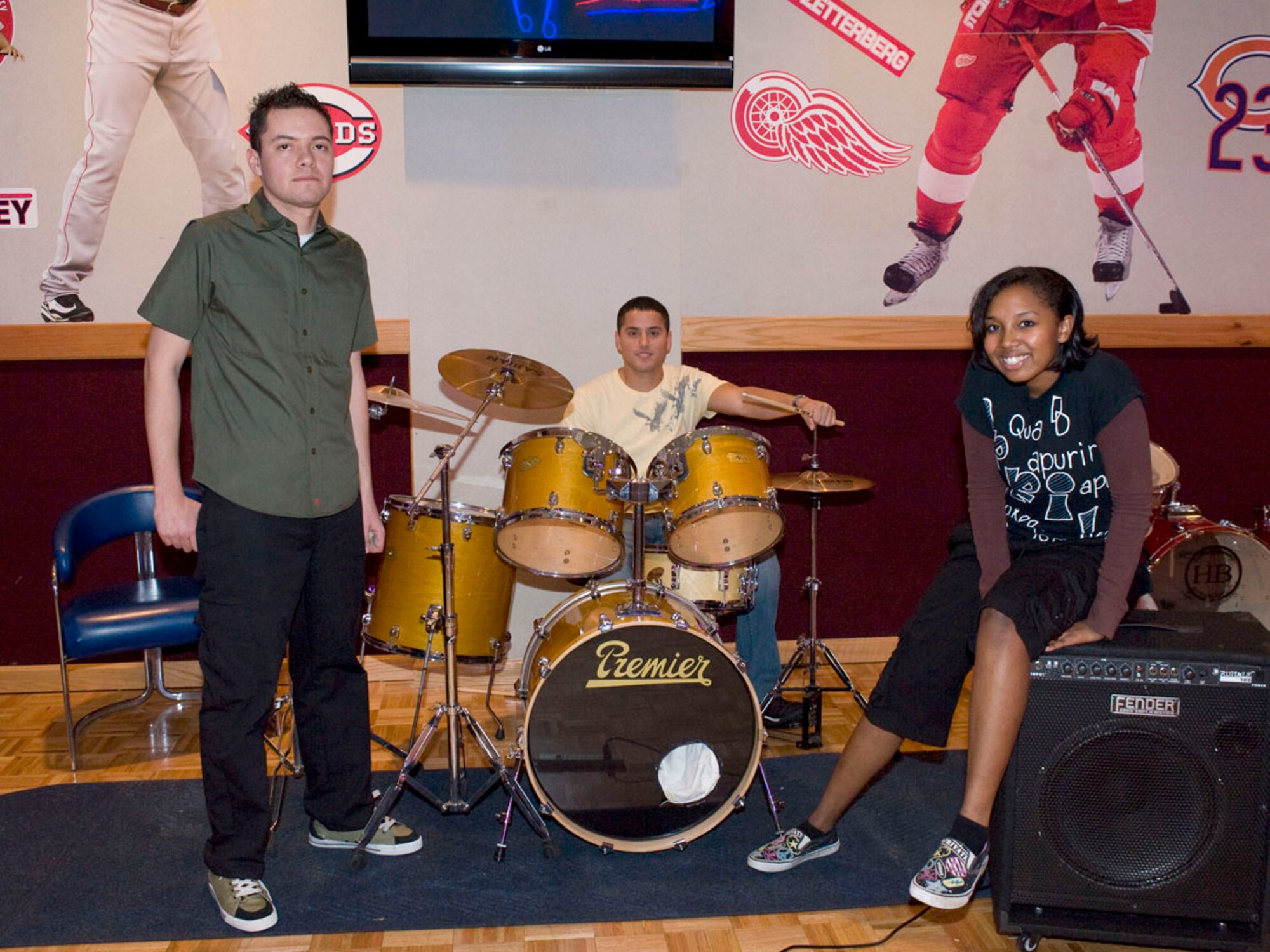 FAIRCHILD AIR FORCE BASE, Wash – The band Pluto on Fire poses for a picture after winning first place in the Battle of the Bands competition at Club Fairchild Oct 23. The band is composed of Senior Airman Mario Menchaca, 92nd Aerospace Medicine Squadron, dental technician, Staff Sgt. Manuel Montalvo, 92nd Medical Operations Squadron, ambulance services, and Senior Airman April Thomas, 92nd Medical Operations Squadron, mental health journeyman. The competition featured four bands from Fairchild with the first and second place band winners receiving $150 dollars. The second round of Battle of the Bands culminates Oct 30 at Club Fairchild and will award $500 dollars to the number one band. (U.S. Air Force photo / Staff Sgt. JT May III)