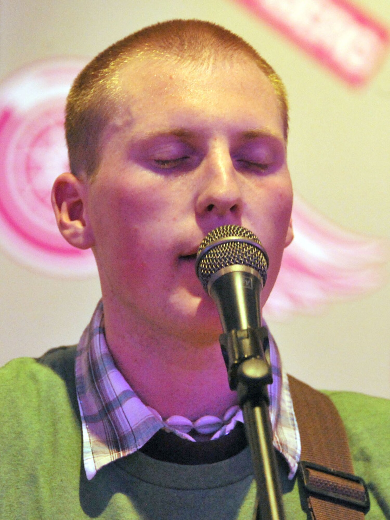 FAIRCHILD AIR FORCE BASE, Wash – Airman First Class Stephen “Austin” Davis, 141st Air National Guard, fuels system mechanic, performs at the Battle of the Bands competition Oct 23 at Club Fairchild.  Airman Davis, 141 ANG, was able to perform his one man band technique when the rest of his band was unable to make it. Davis hard works grab the attention of the judges when he won second place. The name of his band is Austin and the Morningside and will later compete in the $500 dollar competition Oct 30. (U.S. Air Force photo / Staff Sgt. JT May III)