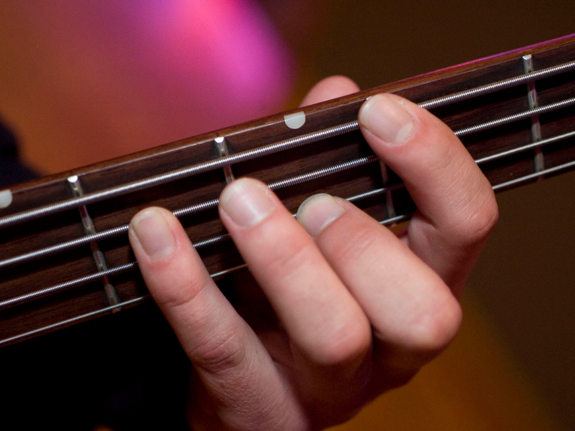 FAIRCHILD AIR FORCE BASE, Wash – Band member strums guitar during the Battle of the Bands competition Oct 23 at Club Fairchild. (U.S. Air Force photo / Staff Sgt. JT May III)

