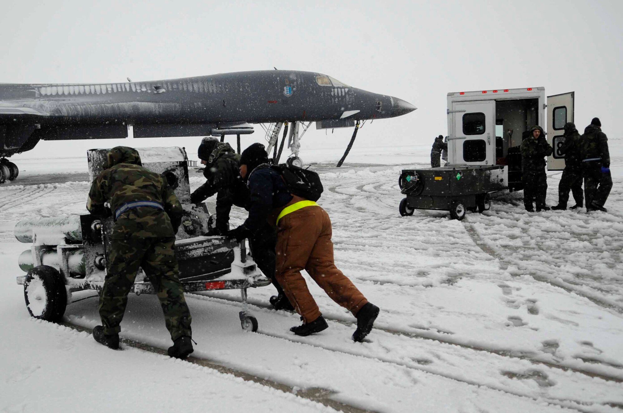 ELLSWORTH AIR FORCE BASE, S.D.--Members of the 28th Maintenance Group keep B-1B Lancer's functional, Oct. 29. Despite the extreme cold and large snowfall in the South Dakota climate, Ellsworth maintainers ensure the readiness of the B-1 fleet. (U.S. Air Force photo/Airman 1st Class Corey Hook)
