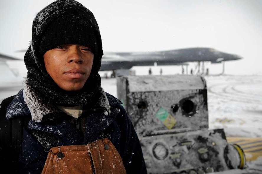 ELLSWORTH AIR FORCE BASE, S.D.--Airman 1st Class Richard Redick, 28th Aircraft Maintenance Squadron crew chief, braves inclement weather to help fulfill the Air Force mission fly, fight and win, Oct. 29. Airman Redick works in freezing temperatures and strong winds to maintain operational readiness in today's fight. (U.S. Air Force photo/Airman 1st Class Corey Hook)