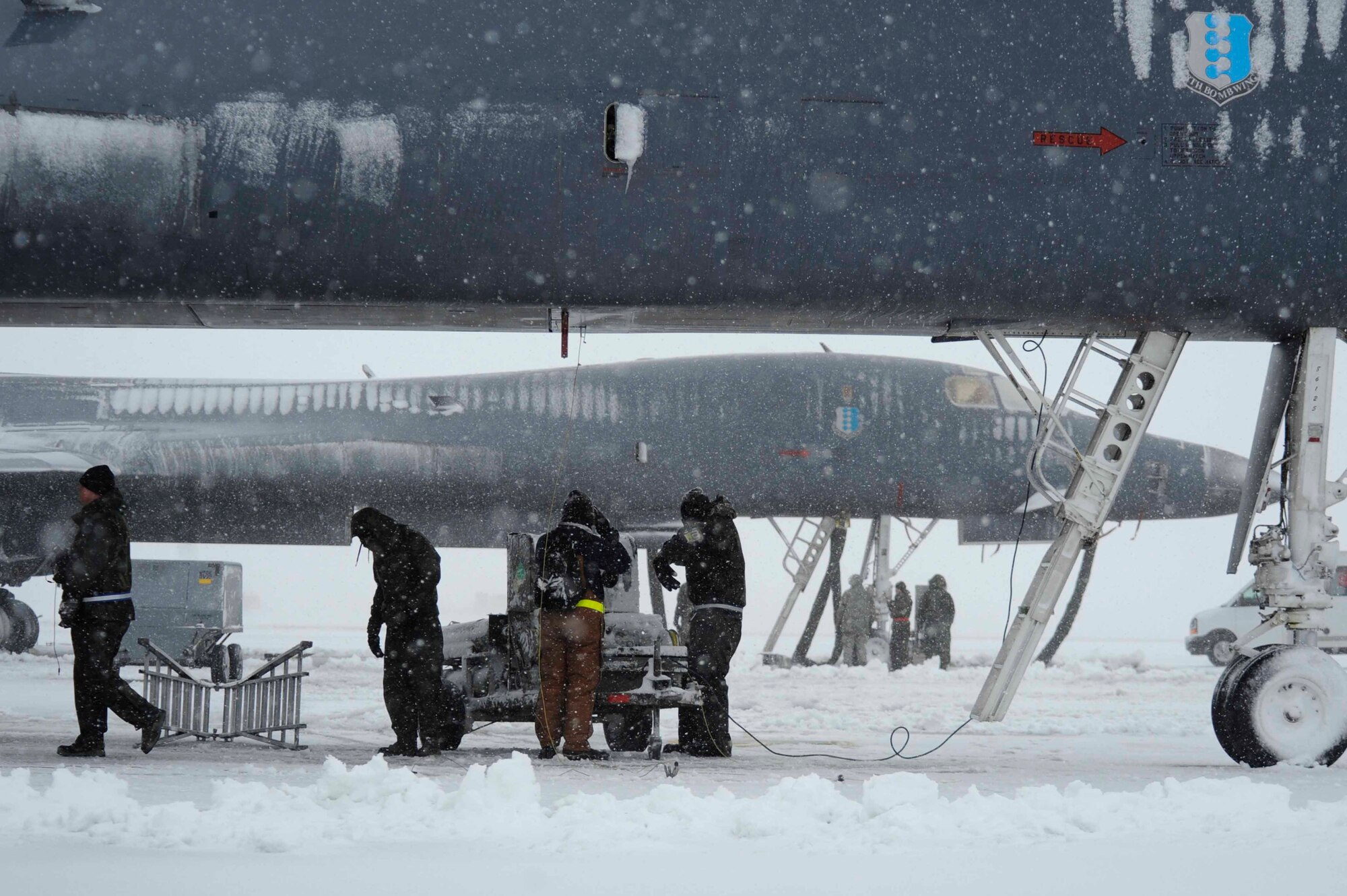 ELLSWORTH AIR FORCE BASE, S.D.--Members of the 28th Maintenance Group keep B-1B Lancer's functional, Oct. 29. Despite the extreme cold and large snowfall in the South Dakota climate, Ellsworth maintainers ensure the readiness of the B-1 fleet. (U.S. Air Force photo/Airman 1st Class Corey Hook)