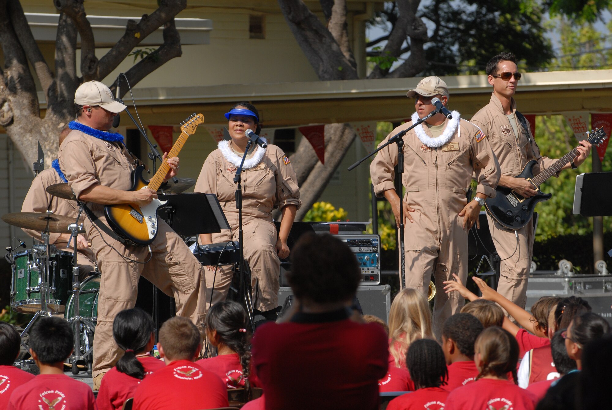 HICKAM AIR FORCE BASE, Hawaii -- The U.S. Air Force Band of the Pacificperform for a crowd of Hickam Elementary School students here, Oct. 29. Hickam, one of two elementary schools on base, was one of six schools the band performed for in support of Red Ribbon Week. Red Ribbon Week focuses on living and maintaining a drug free lifestyle. (U.S. Air Force photo/Senior Airman Gustavo Gonzalez)