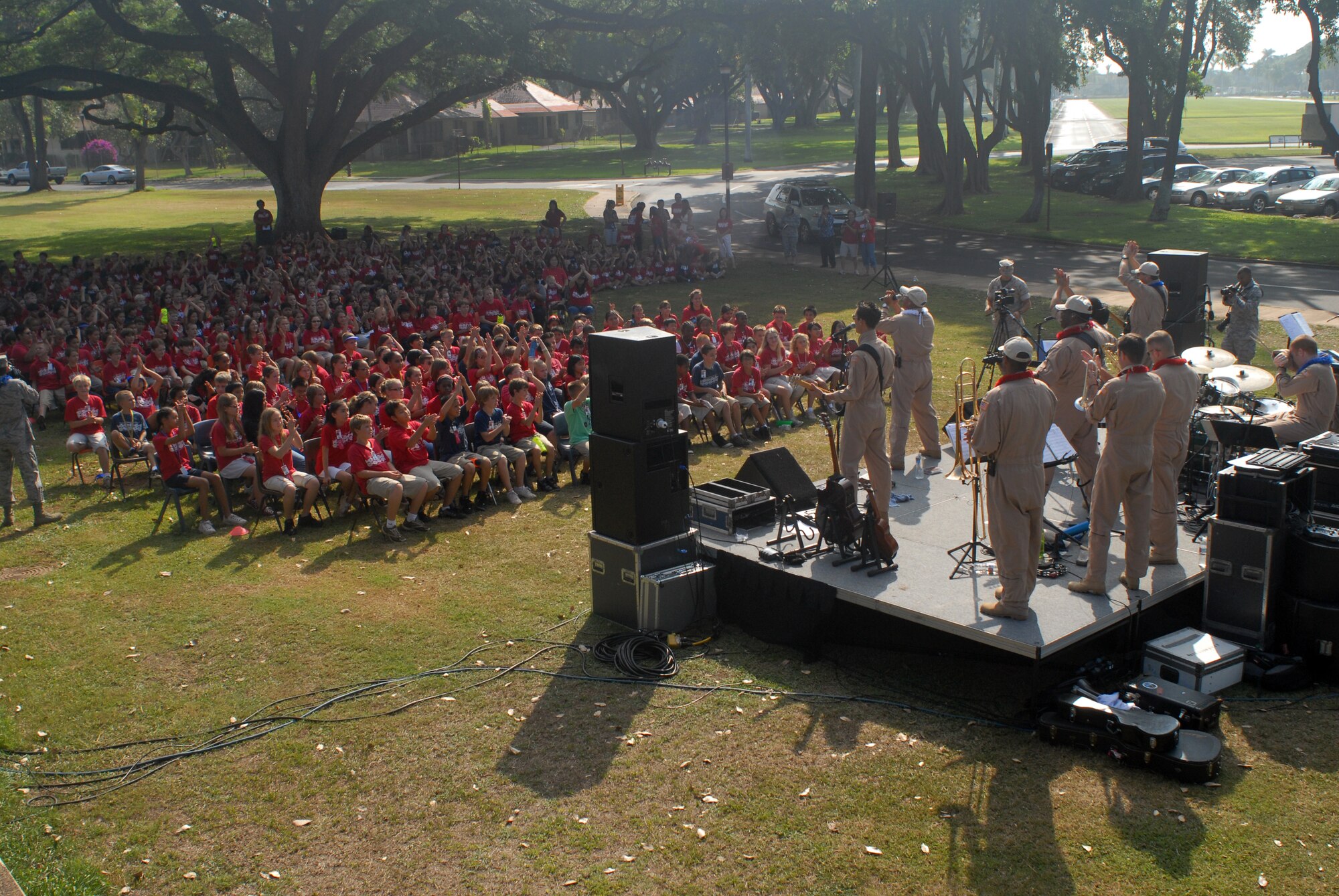 HICKAM AIR FORCE BASE, Hawaii -- The U.S. Air Force Band of the Pacific performs for a crowd of Hickam Elementary School students here, Oct. 29. Hickam, one of two elementary schools on base, was one of six schools the band performed for in support of Red Ribbon Week. Red Ribbon Week focuses on living and maintaining a drug free lifestyle. (U.S. Air Force photo/Senior Airman Gustavo Gonzalez)