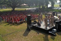 HICKAM AIR FORCE BASE, Hawaii -- The U.S. Air Force Band of the Pacific performs for a crowd of Hickam Elementary School students here, Oct. 29. Hickam, one of two elementary schools on base, was one of six schools the band performed for in support of Red Ribbon Week. Red Ribbon Week focuses on living and maintaining a drug free lifestyle. (U.S. Air Force photo/Senior Airman Gustavo Gonzalez)