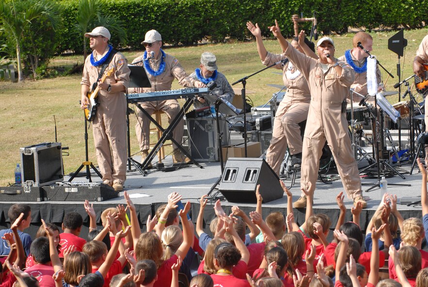 HICKAM AIR FORCE BASE, Hawaii -- The U.S. Air Force Band of the Pacific perform for a crowd of Hickam Elementary School students here, Oct. 29. Hickam, one of two elementary schools on base, was one of six schools the band performed for in support of Red Ribbon Week. Red Ribbon Week focuses on living and maintaining a drug free lifestyle. (U.S. Air Force photo/Senior Airman Gustavo Gonzalez)