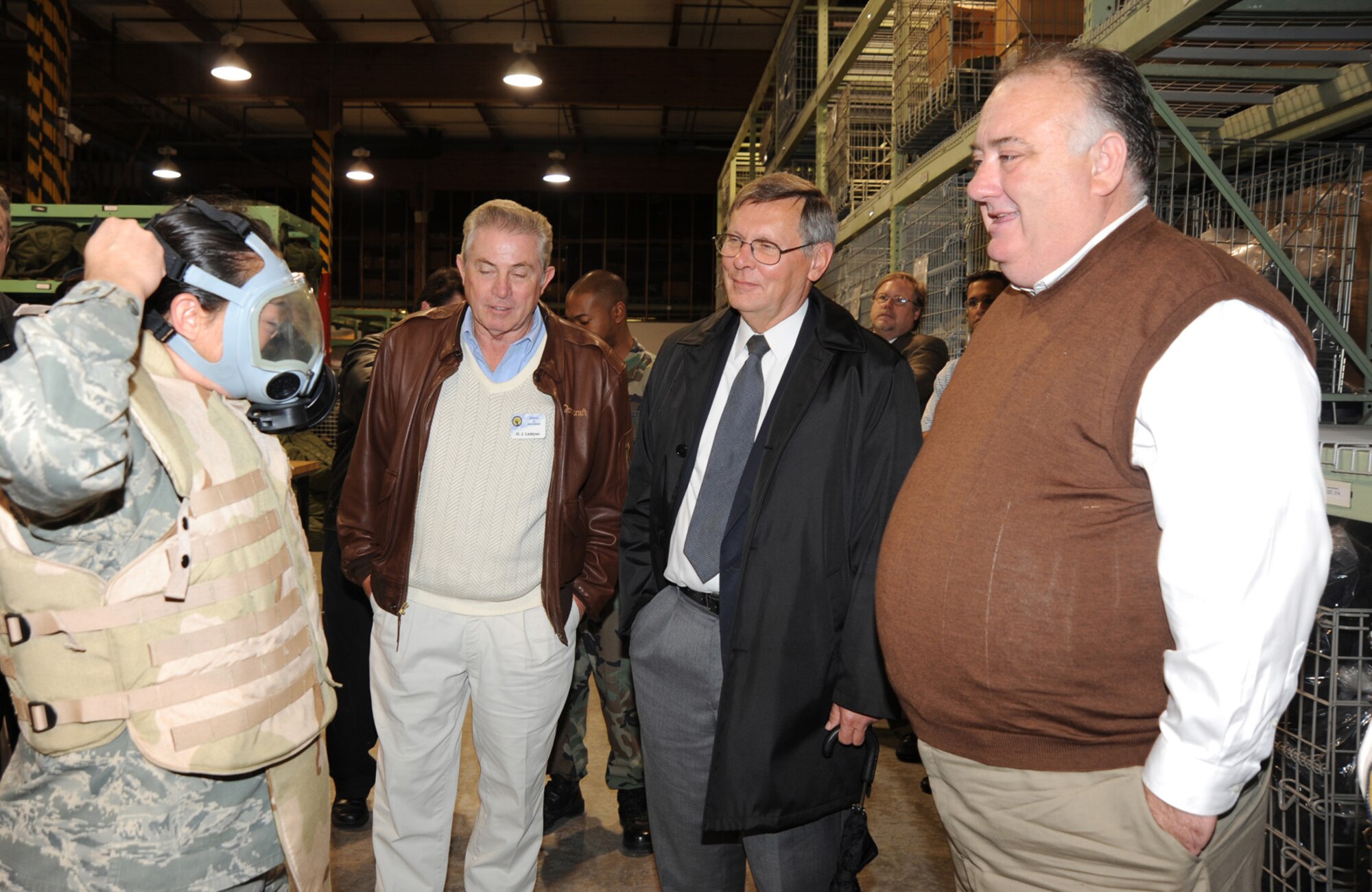 Derby Police Chief Robert Lee (at far right) watches Airman Megan Tetreault demonstrate the wearing of a gas mask at McConnell Air Force Base, Kan., on Oct. 29. Lee is the honorary commander of the 931st Mission Support Flight, an Air Force Reserve unit at the base. The demonstration was part of an orientation course for Lee and other honorary commanders of McConnell units. (U.S. Air Force photo/Tech. Sgt. Chyrece Campbell) 
