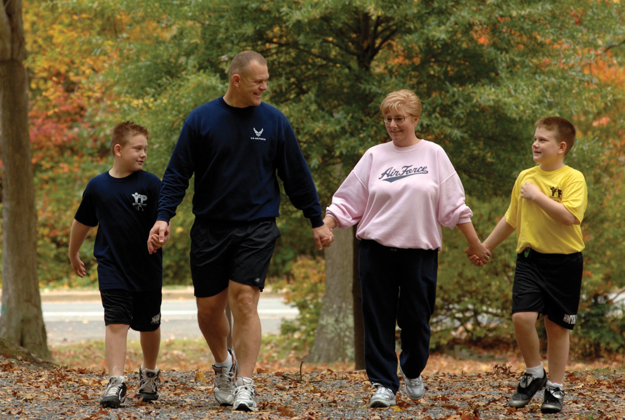Chief Master Sgt. of the Air Force James Roy, his wife, Paula, and their two boys, Caleb, far left, and Colby, far right, both age 9, take a walk on Joint Base Andrews Saturday. Military families face many challenges and benefits, and November is a month set aside to recognize these. (U.S. Air Force photo/ Staff Sgt. Melissa Stonecipher)