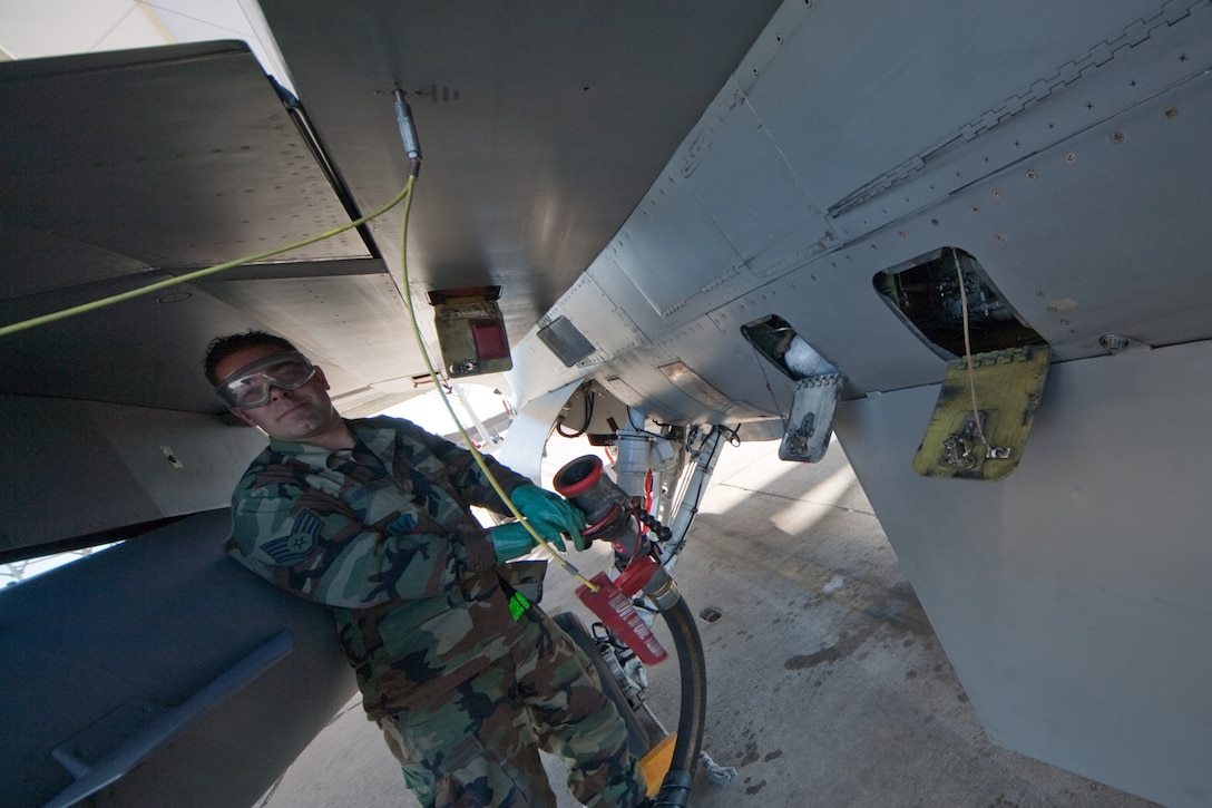 Air Force Staff Sgt. Brandon Brooks conducts F-16 refueling operations at Davis-Monthan Air Force Base, Tucson, AZ, November 21, 2009. The 121FS, D.C. Air National Guard, is receiving two weeks of training in preparation for an upcoming Aerospace Expeditionary Force deployment in 2010. (U.S. Air Force photo by Staff Sgt. Gareth Buckland/Released)

