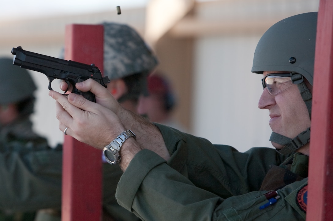 Air Force Major Steve “Velvet” Jones, an F-16 pilot with the 201st Fighter Squadron, fires a round during M9 pistol training at Davis-Monthan Air Force Base, Tucson, AZ, November 21, 2009. The 121FS, D.C. Air National Guard, is receiving two weeks of training in preparation for an upcoming Aerospace Expeditionary Force deployment in 2010. (U.S. Air Force photo by Staff Sgt. Gareth Buckland/Released).

