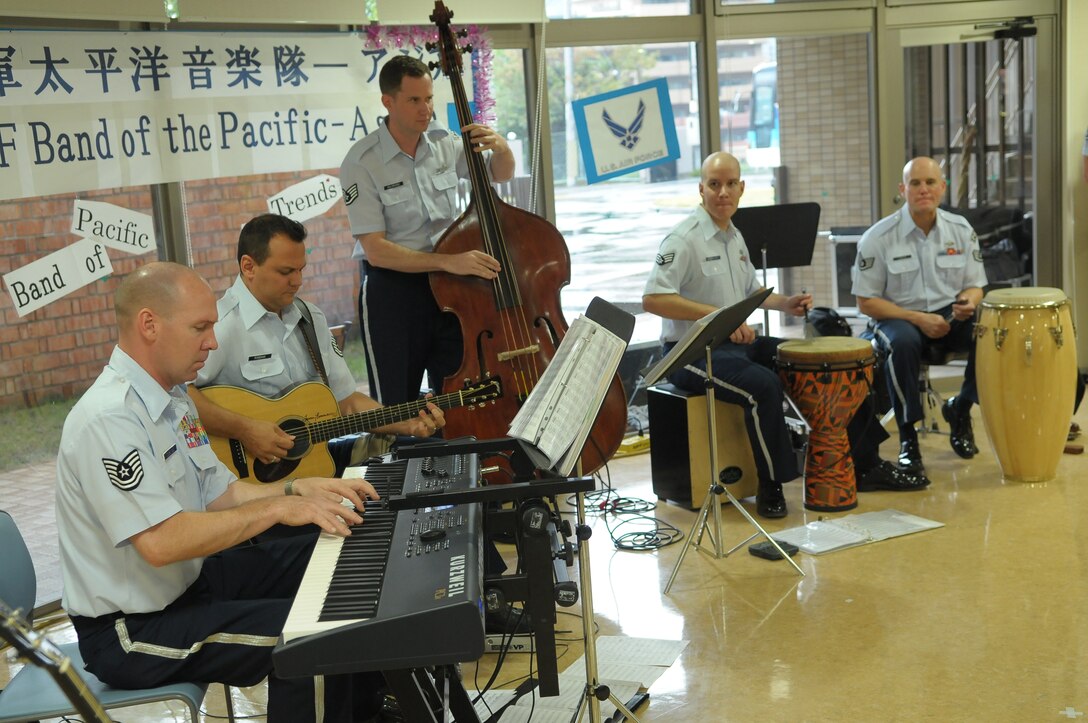 10/15/2009 – Hiroshima, Japan – They’ve played before select crowds before – heads of state, military leaders and the like.  But, for the members of the U.S. Air Force Band of the Pacific-Asia, the crowd at the Oct. 14 show in southern Japan was not only exclusive, but held special meaning for the performers.  The band, five days into a 10-day tour, played before 100 residents of the Yano Orizuru-en nursing home in Hiroshima.  Constructed only three years ago, the one-of-kind home’s residents are all survivors of the Aug. 6, 1945, atomic bomb attack on Hiroshima.  Residents range in age from 66 to 107 years and there’s a waiting list of nearly 2,000 to get into the facility.  “The patients were all very welcoming to us,” said Tech. Sgt. Gary Rosenak, U.S. Air Force Band of the Pacific-Asia guitarist.  “It made us feel good to do something like this for them.”  The patients as well as the staff of the nursing home were very thankful and appreciative of the band and their music, according to Nobua Murata, chief of the nursing home.  Following the performance, a few audience members presented gifts of thanks to band members.  “We rarely get opportunities to listen to live music, and we enjoyed it very much,” said Mr. Murata.  “It  was also the first time the band has come to play here for us, which was also a huge honor.”  Band members said they felt honored to perform at the home and wanted to show the patients respect for what they had gone through, according to Sergeant Rosenak.  “We want to keep building our relationship with them,” he said.  “We would be honored to perform again if they invited us here in the future.”                
by Airman First Class Sean Martin                                                                                                                             374th Airlift Wing Public Affairs
