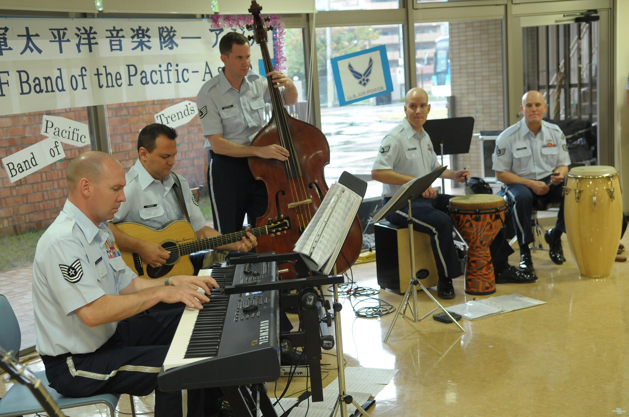 10/15/2009 – Hiroshima, Japan – They’ve played before select crowds before – heads of state, military leaders and the like.  But, for the members of the U.S. Air Force Band of the Pacific-Asia, the crowd at the Oct. 14 show in southern Japan was not only exclusive, but held special meaning for the performers.  The band, five days into a 10-day tour, played before 100 residents of the Yano Orizuru-en nursing home in Hiroshima.  Constructed only three years ago, the one-of-kind home’s residents are all survivors of the Aug. 6, 1945, atomic bomb attack on Hiroshima.  Residents range in age from 66 to 107 years and there’s a waiting list of nearly 2,000 to get into the facility.  “The patients were all very welcoming to us,” said Tech. Sgt. Gary Rosenak, U.S. Air Force Band of the Pacific-Asia guitarist.  “It made us feel good to do something like this for them.”  The patients as well as the staff of the nursing home were very thankful and appreciative of the band and their music, according to Nobua Murata, chief of the nursing home.  Following the performance, a few audience members presented gifts of thanks to band members.  “We rarely get opportunities to listen to live music, and we enjoyed it very much,” said Mr. Murata.  “It  was also the first time the band has come to play here for us, which was also a huge honor.”  Band members said they felt honored to perform at the home and wanted to show the patients respect for what they had gone through, according to Sergeant Rosenak.  “We want to keep building our relationship with them,” he said.  “We would be honored to perform again if they invited us here in the future.”                
by Airman First Class Sean Martin                                                                                                                             374th Airlift Wing Public Affairs
