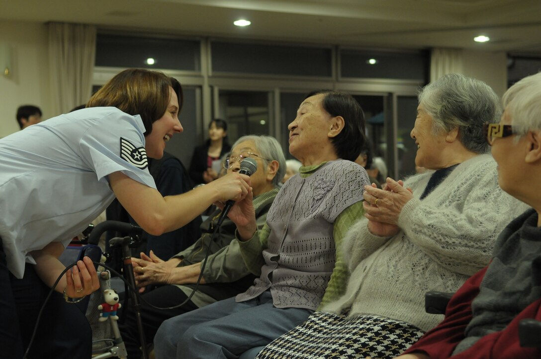10/15/2009 – Hiroshima, Japan – They’ve played before select crowds before – heads of state, military leaders and the like.  But, for the members of the U.S. Air Force Band of the Pacific-Asia, the crowd at the Oct. 14 show in southern Japan was not only exclusive, but held special meaning for the performers.  The band, five days into a 10-day tour, played before 100 residents of the Yano Orizuru-en nursing home in Hiroshima.  Constructed only three years ago, the one-of-kind home’s residents are all survivors of the Aug. 6, 1945, atomic bomb attack on Hiroshima.  Residents range in age from 66 to 107 years and there’s a waiting list of nearly 2,000 to get into the facility.  “The patients were all very welcoming to us,” said Tech. Sgt. Gary Rosenak, U.S. Air Force Band of the Pacific-Asia guitarist.  “It made us feel good to do something like this for them.”  The patients as well as the staff of the nursing home were very thankful and appreciative of the band and their music, according to Nobua Murata, chief of the nursing home.  Following the performance, a few audience members presented gifts of thanks to band members.  “We rarely get opportunities to listen to live music, and we enjoyed it very much,” said Mr. Murata.  “It  was also the first time the band has come to play here for us, which was also a huge honor.”  Band members said they felt honored to perform at the home and wanted to show the patients respect for what they had gone through, according to Sergeant Rosenak.  “We want to keep building our relationship with them,” he said.  “We would be honored to perform again if they invited us here in the future.”                
by Airman First Class Sean Martin                                                                                                                             374th Airlift Wing Public Affairs
