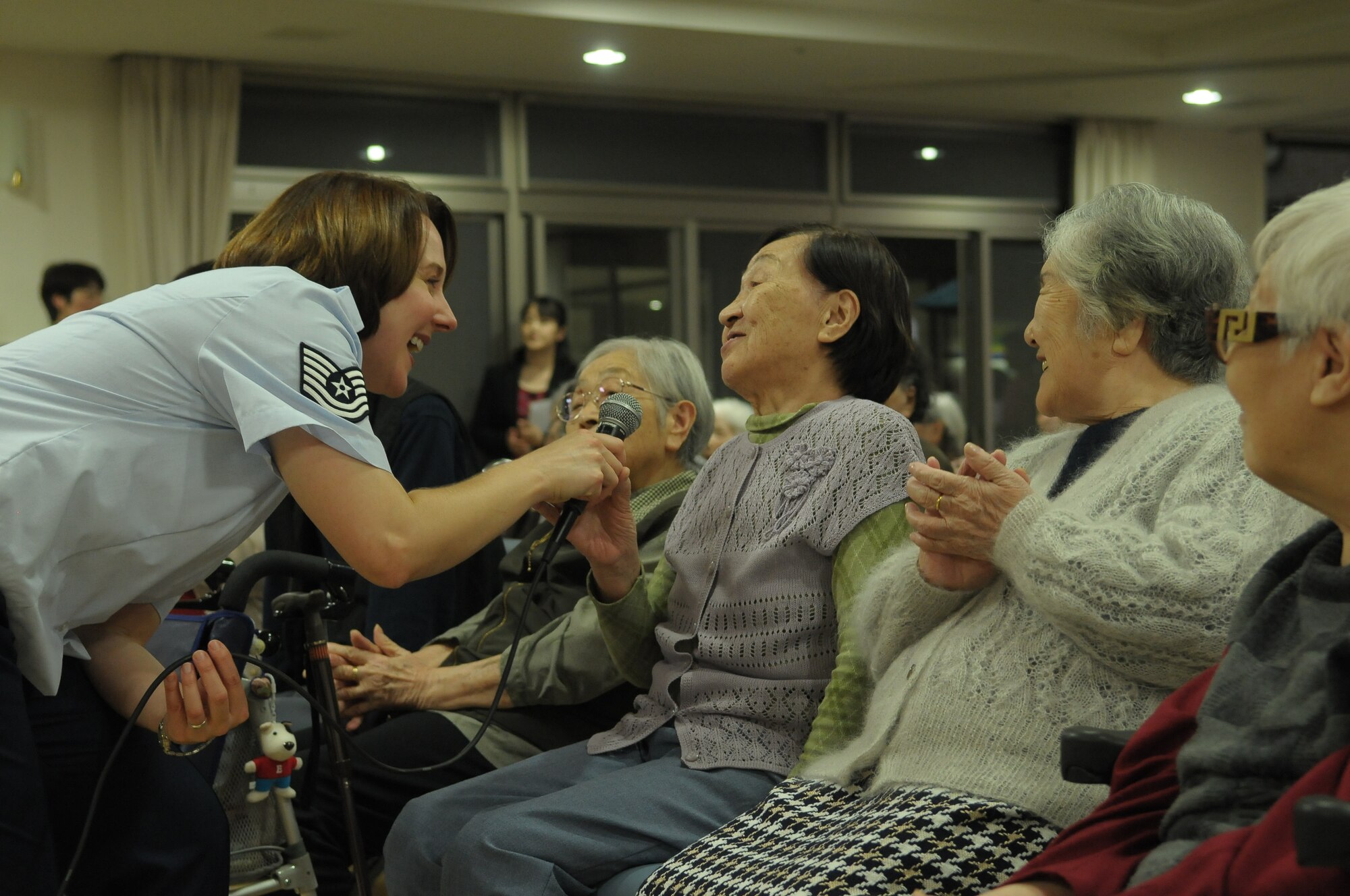10/15/2009 – Hiroshima, Japan – They’ve played before select crowds before – heads of state, military leaders and the like.  But, for the members of the U.S. Air Force Band of the Pacific-Asia, the crowd at the Oct. 14 show in southern Japan was not only exclusive, but held special meaning for the performers.  The band, five days into a 10-day tour, played before 100 residents of the Yano Orizuru-en nursing home in Hiroshima.  Constructed only three years ago, the one-of-kind home’s residents are all survivors of the Aug. 6, 1945, atomic bomb attack on Hiroshima.  Residents range in age from 66 to 107 years and there’s a waiting list of nearly 2,000 to get into the facility.  “The patients were all very welcoming to us,” said Tech. Sgt. Gary Rosenak, U.S. Air Force Band of the Pacific-Asia guitarist.  “It made us feel good to do something like this for them.”  The patients as well as the staff of the nursing home were very thankful and appreciative of the band and their music, according to Nobua Murata, chief of the nursing home.  Following the performance, a few audience members presented gifts of thanks to band members.  “We rarely get opportunities to listen to live music, and we enjoyed it very much,” said Mr. Murata.  “It  was also the first time the band has come to play here for us, which was also a huge honor.”  Band members said they felt honored to perform at the home and wanted to show the patients respect for what they had gone through, according to Sergeant Rosenak.  “We want to keep building our relationship with them,” he said.  “We would be honored to perform again if they invited us here in the future.”                
by Airman First Class Sean Martin                                                                                                                             374th Airlift Wing Public Affairs
