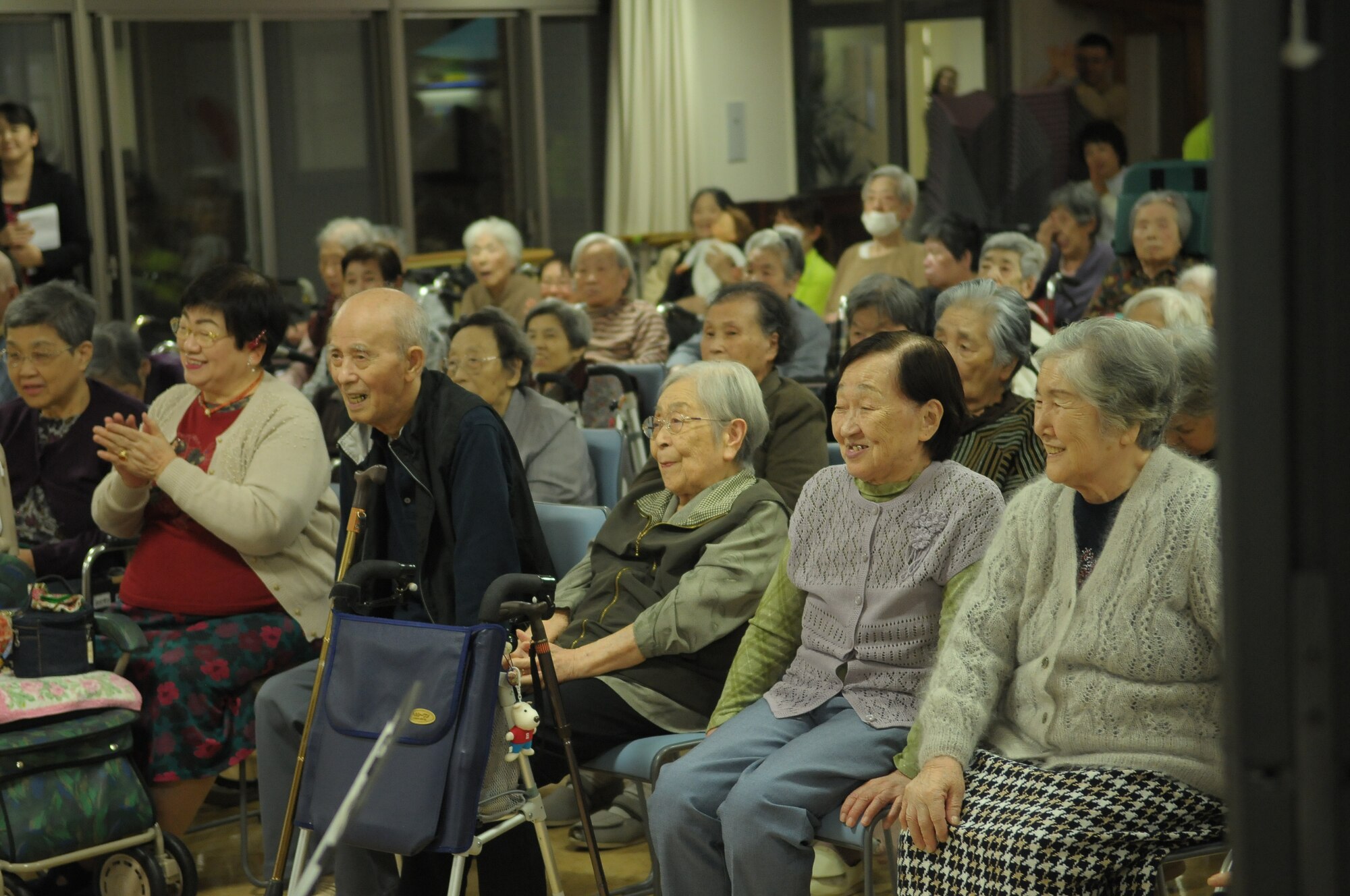 10/15/2009 – Hiroshima, Japan – They’ve played before select crowds before – heads of state, military leaders and the like.  But, for the members of the U.S. Air Force Band of the Pacific-Asia, the crowd at the Oct. 14 show in southern Japan was not only exclusive, but held special meaning for the performers.  The band, five days into a 10-day tour, played before 100 residents of the Yano Orizuru-en nursing home in Hiroshima.  Constructed only three years ago, the one-of-kind home’s residents are all survivors of the Aug. 6, 1945, atomic bomb attack on Hiroshima.  Residents range in age from 66 to 107 years and there’s a waiting list of nearly 2,000 to get into the facility.  “The patients were all very welcoming to us,” said Tech. Sgt. Gary Rosenak, U.S. Air Force Band of the Pacific-Asia guitarist.  “It made us feel good to do something like this for them.”  The patients as well as the staff of the nursing home were very thankful and appreciative of the band and their music, according to Nobua Murata, chief of the nursing home.  Following the performance, a few audience members presented gifts of thanks to band members.  “We rarely get opportunities to listen to live music, and we enjoyed it very much,” said Mr. Murata.  “It  was also the first time the band has come to play here for us, which was also a huge honor.”  Band members said they felt honored to perform at the home and wanted to show the patients respect for what they had gone through, according to Sergeant Rosenak.  “We want to keep building our relationship with them,” he said.  “We would be honored to perform again if they invited us here in the future.”                
by Airman First Class Sean Martin                                                                                                                             374th Airlift Wing Public Affairs
