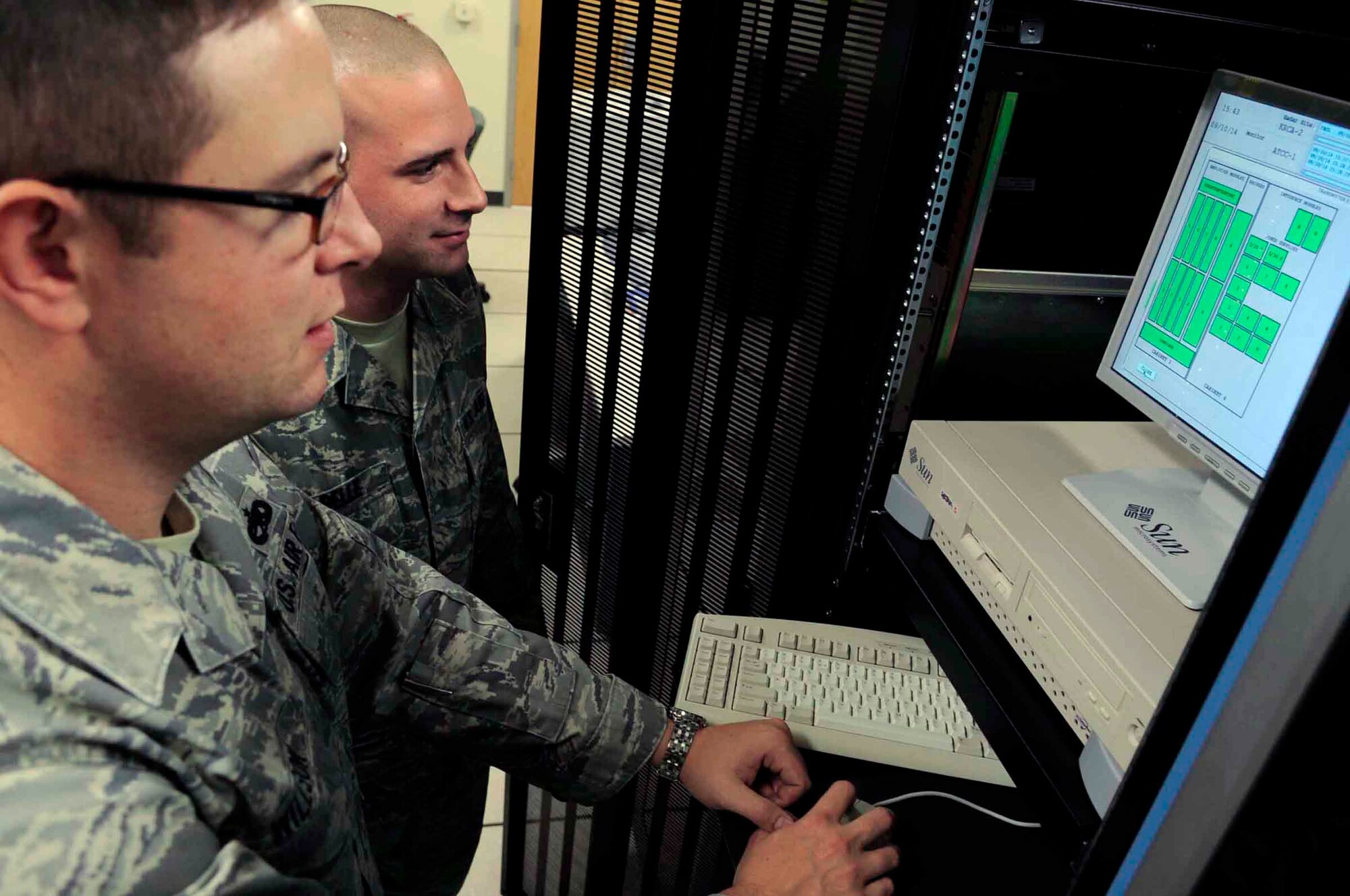 Tech. Sgt. Jason Willson and Airman 1st Class Gary Isabelle view the status of the digital airport surveillance radar Oct. 14, 2009, at Ellsworth Air Force Base, S.D. Sergeant Wilson is the 28th Communications Squadron radar maintenance NCO in charge, and Airman Isabelle is a 28th CS radar maintenance technician. (U.S. Air Force photo/Airman 1st Class Corey Hook) 