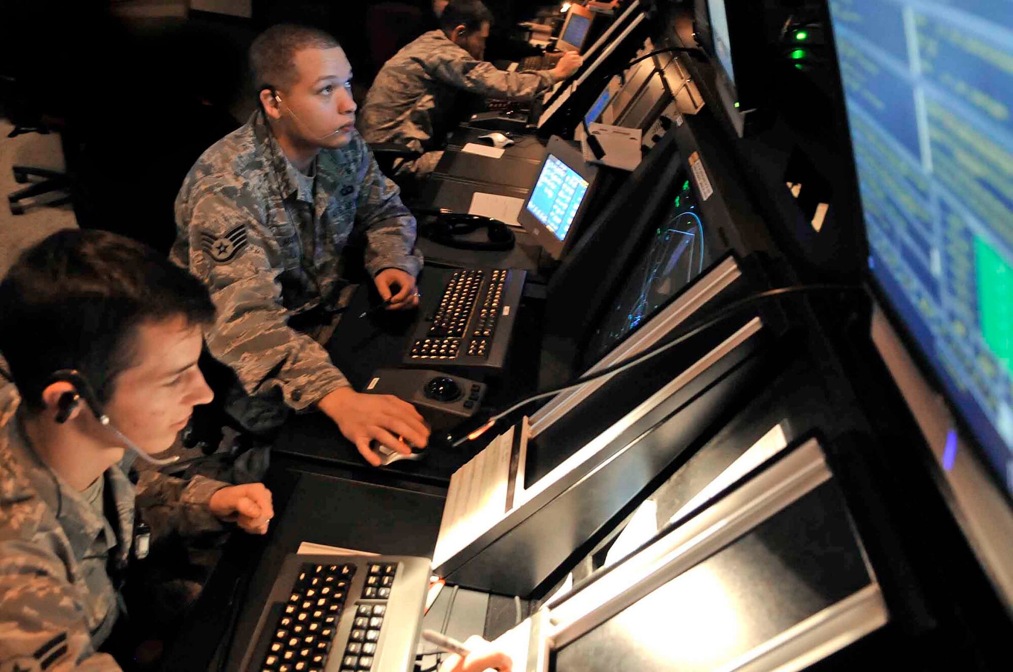 Airman 1st Class Ryan Anger and Staff Sgt. Jacob Martin manage air traffic Oct. 14, 2009, at Ellsworth Air Force Base, S.D. Airman Anger and Sergeant Martin are 28th Operations Support Squadron air traffic controllers. (U.S. Air Force photo/Airman 1st Class Corey Hook)