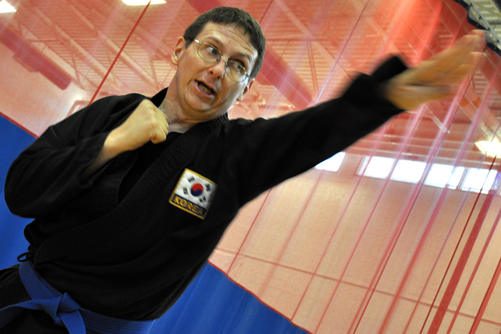 EGLIN AIR FORCE BASE, Fla. – Master Sgt. Kevin Schweitzer, 1st Special Operations Maintenance Squadron, practices defense techniques during a Kuk Sool Won training session at the Eglin Fitness Center here. Kuk Sool encompasses many different “styles” of traditional martial arts and combines kicking, punching, throwing, falling, and joint-locking as well as a myriad of weapons techniques into a dynamic ‘hard-soft’ style, emphasizing speed and fluidity. (U.S. Air Force photo/ Airman 1st Class Anthony Jennings)