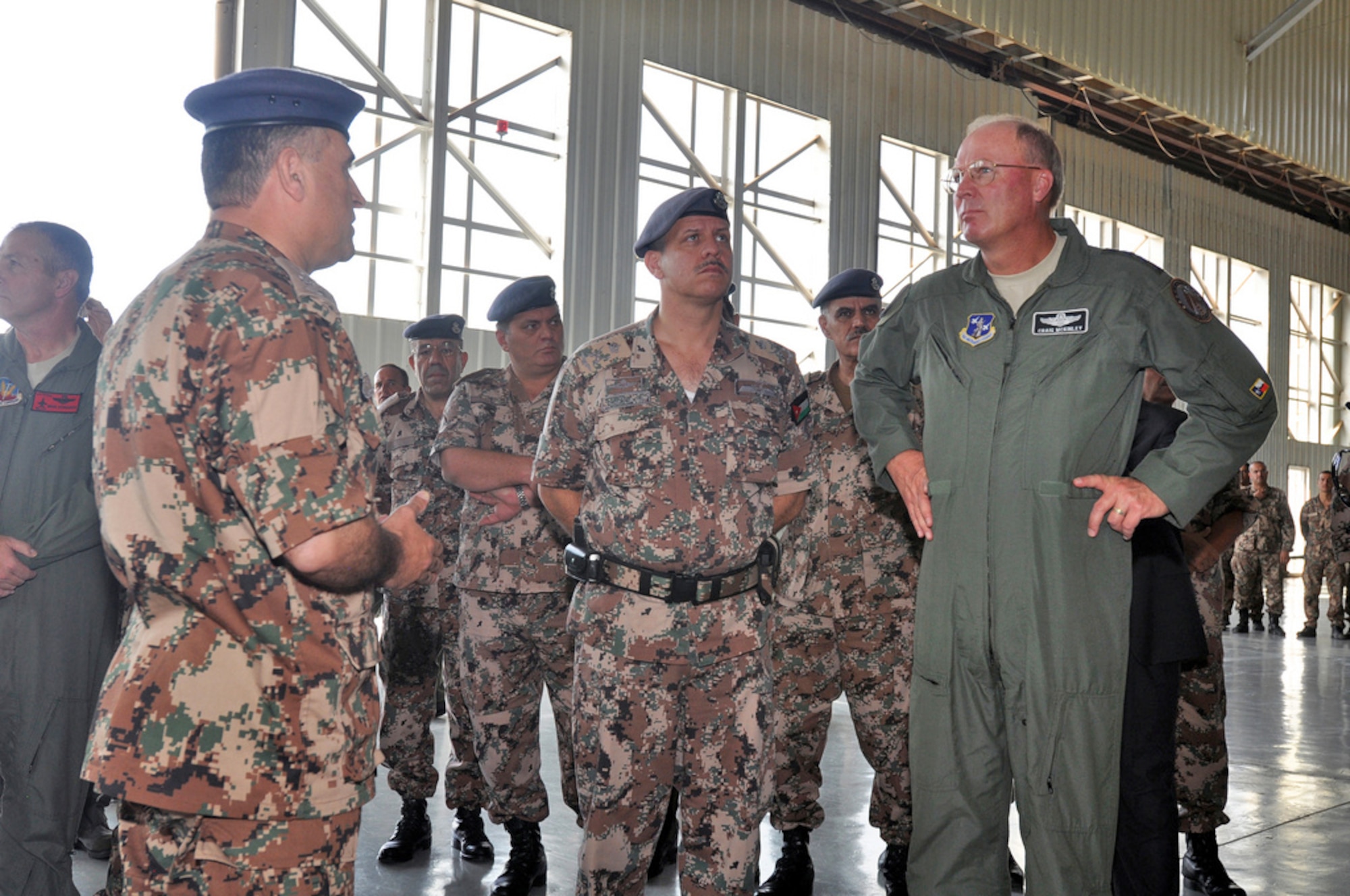 His Royal Highness Prince Feisal Ibn Al-Hussein (center) and Gen. Craig McKinley, the chief of the National Guard Bureau, right, visit an aircraft maintenance facility at Mwaffaq Salti Air Base, Azraq, Jordan, on Oct. 28, 2009. Jordan is partnered with Colorado in the National Guard's State Partnership Program. (U.S. Army photo/Staff Sgt. Jim Greenhill)