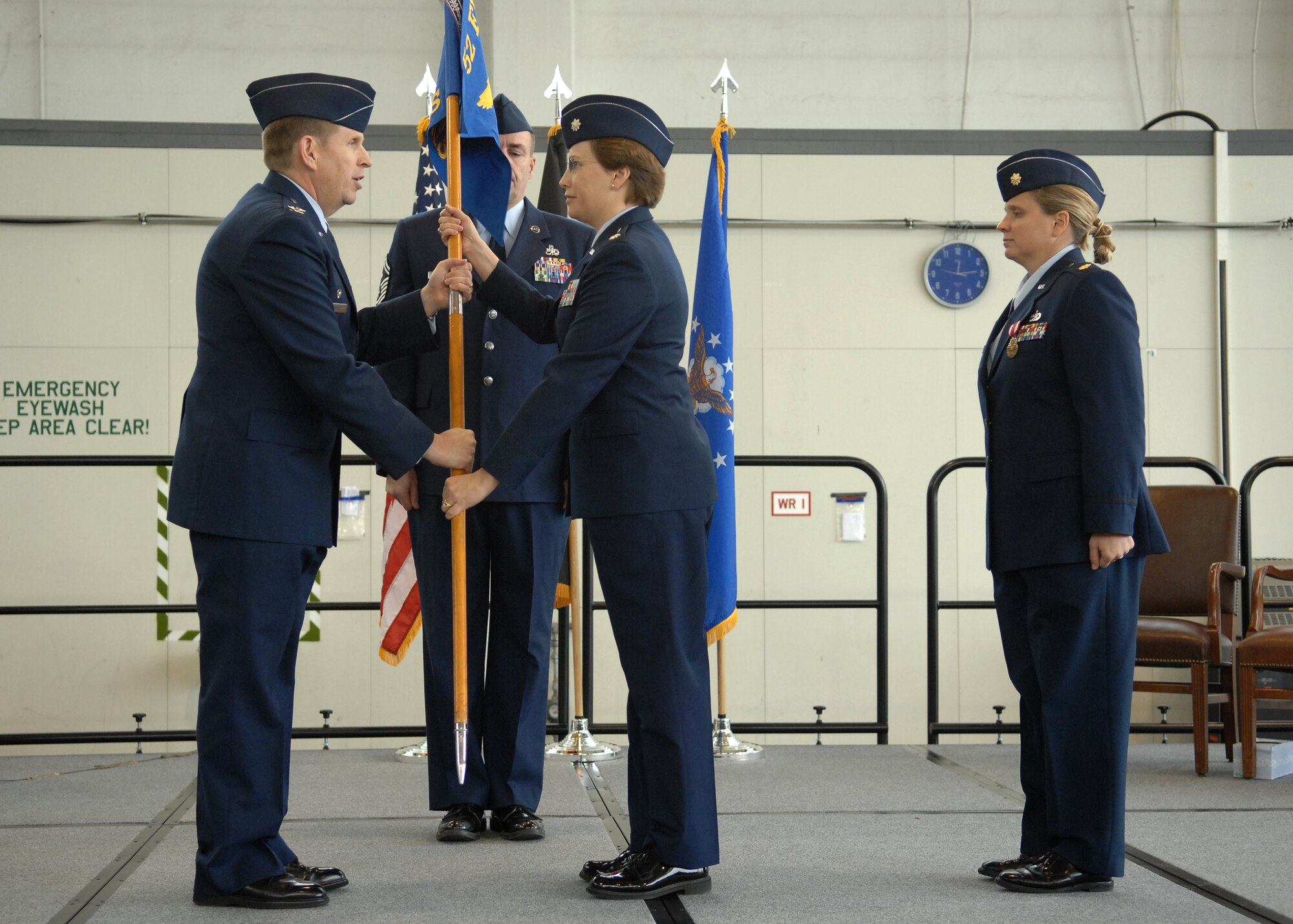 SPANGDAHLEM AIR BASE, Germany -- Lt. Col. Carol Joyner, 52nd Equipment Maintenance Squadron commander, receives the 52nd EMS guidon from Col. John Morley, 52nd Maintenance Group commander, during the change-of-command ceremony here Oct. 29. Colonel Joyner was selected to replace Maj. Kelley Stevens. (U.S. Air Force photo/Airman 1st Class Nathanael Callon)