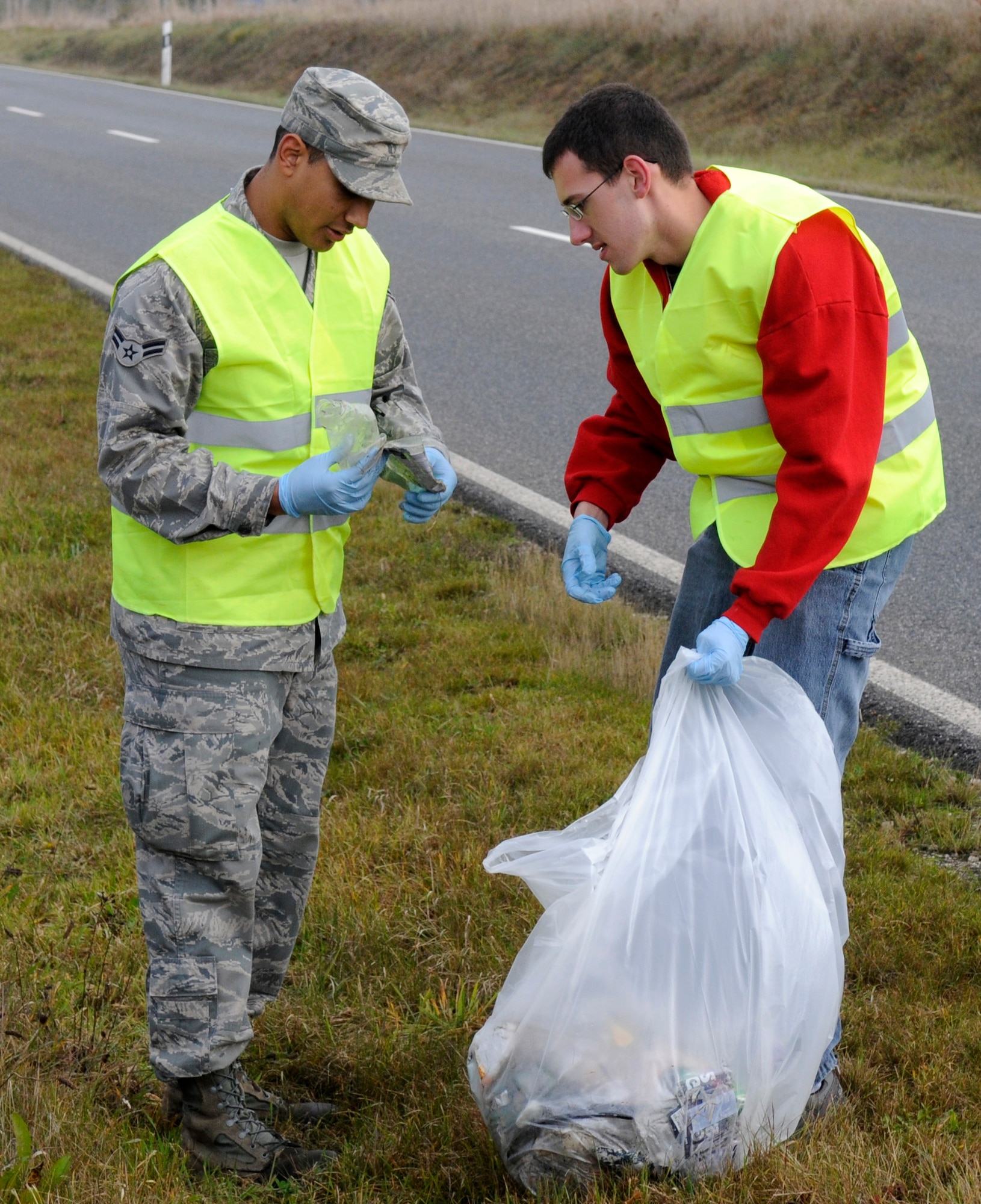 SPANGDAHLEM AIR BASE, Germany – Airmen from the 52nd Component Maintenance Squadron Avionics Flight, work together to collect trash and other debris along the L-46 near the base Oct. 30. The event was organized by the Eifel Riders, a motorcycle mentorship club dedicated to rider camaraderie and safety. About 80 participates split into groups and walked along the L-46, A-60 and B-50 collecting 110 bags of trash that filled two and a half dumpsters. (U.S. Air Force photo/Airman 1st Class Staci Miller)