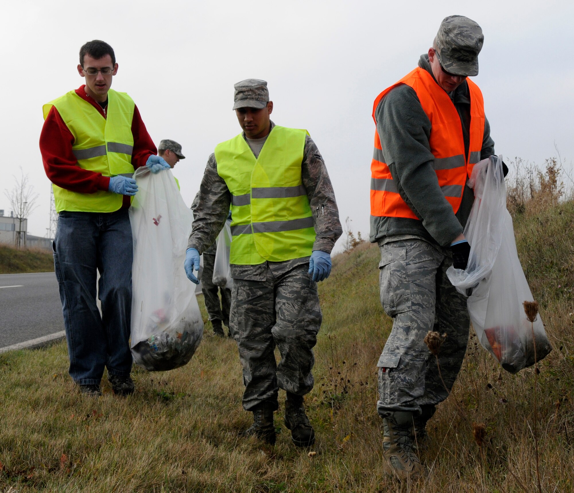 SPANGDAHLEM AIR BASE, Germany – Airmen from the 52nd Component Maintenance Squadron Avionics Flight, work together to collect trash and other debris along the L-46 near the base Oct. 30. The event was organized by the Eifel Riders, a motorcycle mentorship club dedicated to rider camaraderie and safety. About 80 participates split into groups and walked along the L-46, A-60 and B-50 collecting 110 bags of trash that filled two and a half dumpsters. (U.S. Air Force photo/Airman 1st Class Staci Miller)
